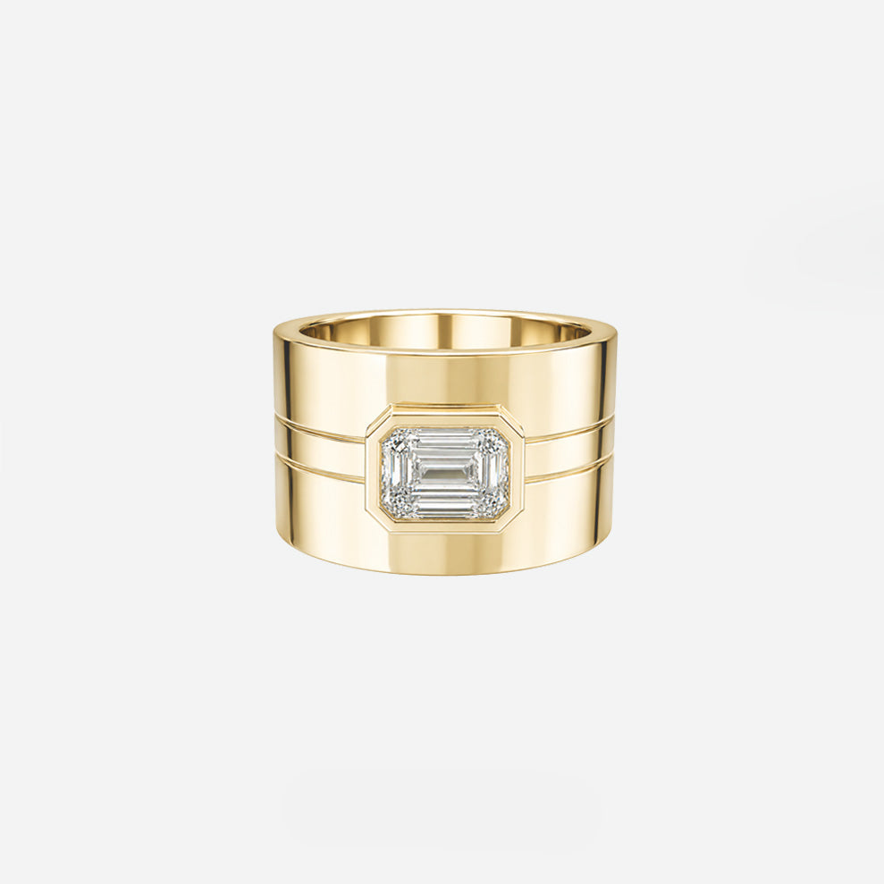 A wide gold ring with a central rectangular clear gemstone, shown on a light gray background with small text below reading 'COMPLETE THE SET CURVED BANDS ARE SOLD SEPARATELY.'.
