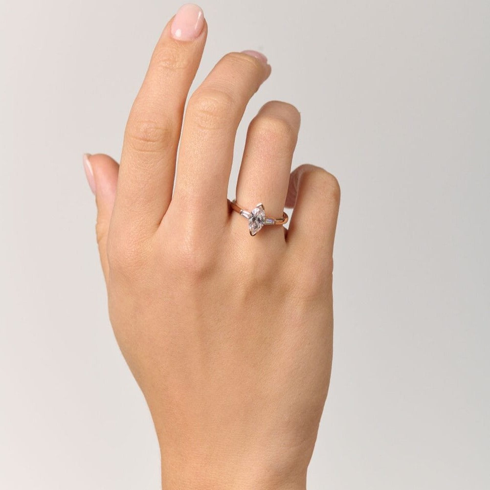 Rings-Your perfect art-deco dream. The striking beauty of the marquise diamond is the focus of this stunning engagement ring. The trilogy arrangement with the tapered baguettes on either side of the centre stone creates a crescendo of sparkling beauty. - VIDEO 1- VIDEO 2-ELIISE MAAR JEWELLERY