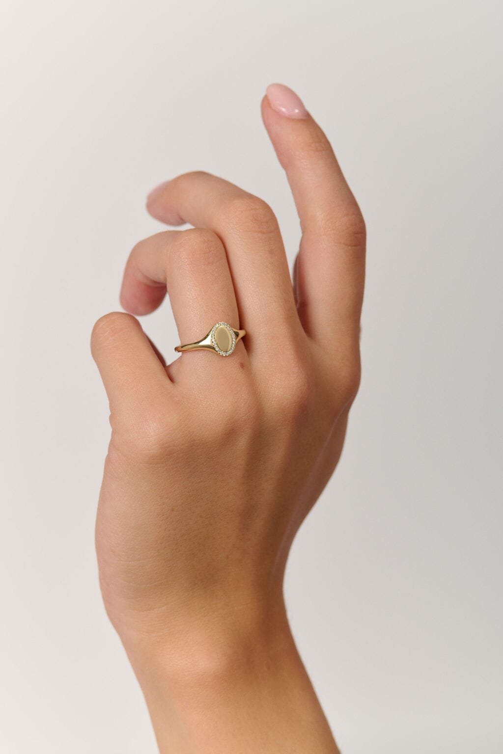 Rings-An elevated take on a classic signet ring. With an antique inspired shape this timeless ring is embellished with a delicate halo of small diamonds around the oval face of the ring.-ELIISE MAAR JEWELLERY