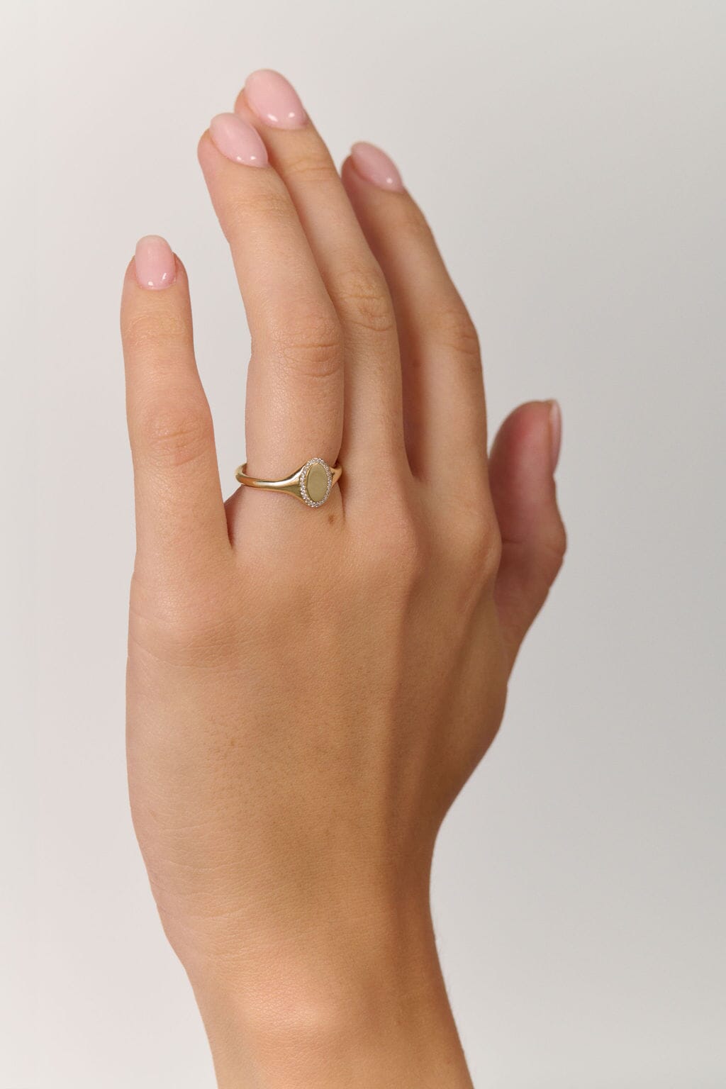 Rings-An elevated take on a classic signet ring. With an antique inspired shape this timeless ring is embellished with a delicate halo of small diamonds around the oval face of the ring.-ELIISE MAAR JEWELLERY