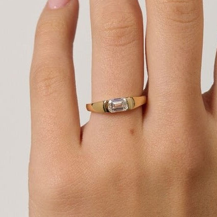Rings-A modern and elegant signet band. Featuring an east-west half bezel set emerald cut diamond. This ring is the perfect understated engagement ring or striking signet band. Pair with the Petite Nadia Diamond Band for an elevated wedding set.-ELIISE MAAR JEWELLERY