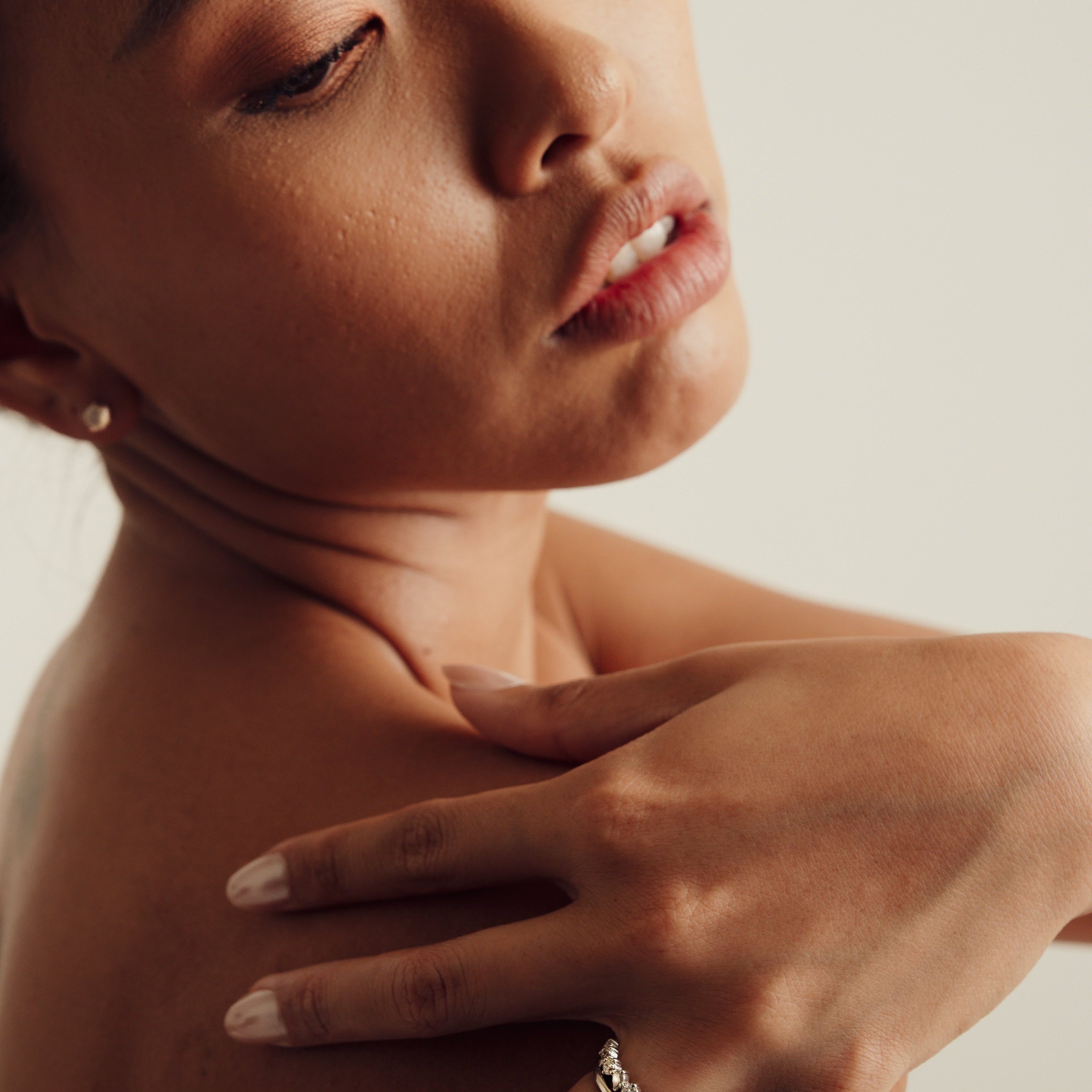 Rings-Drawing inspiration from Grace Kelly, this solitaire ring embodies timeless elegance. Featuring a 4-claw setting and a smoothly rounded band, it offers a subtle frame that highlights the radiant oval diamond at its center. An ideal engagement ring, it complements any wedding band to form a distinctive and personalized set. Shown paired with the 4.0mm Ceremonial Square Band and the Eleanor Luxe Diamond Band.-ELIISE MAAR JEWELLERY