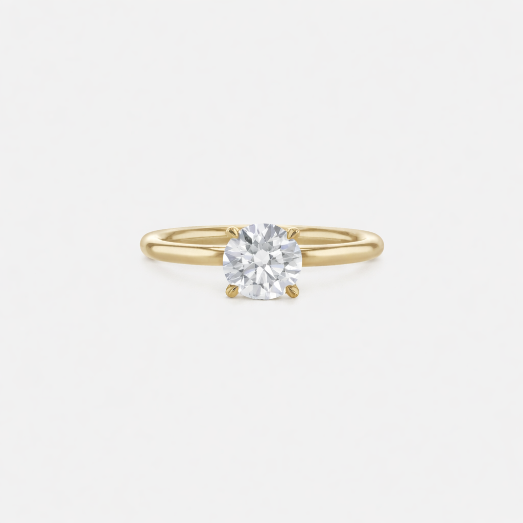 Rings-An elevated solitaire. With a beautiful round cut centre stone and hidden halo on the girdle of the 4 claw basket. The hidden halo provides a beautiful added sparkle to the ring from all angles without interfering with the power of the centre stone. This ring pairs beautifully with wedding bands, we recommend trying the Petite Josephine and the Eleanor.-ELIISE MAAR JEWELLERY