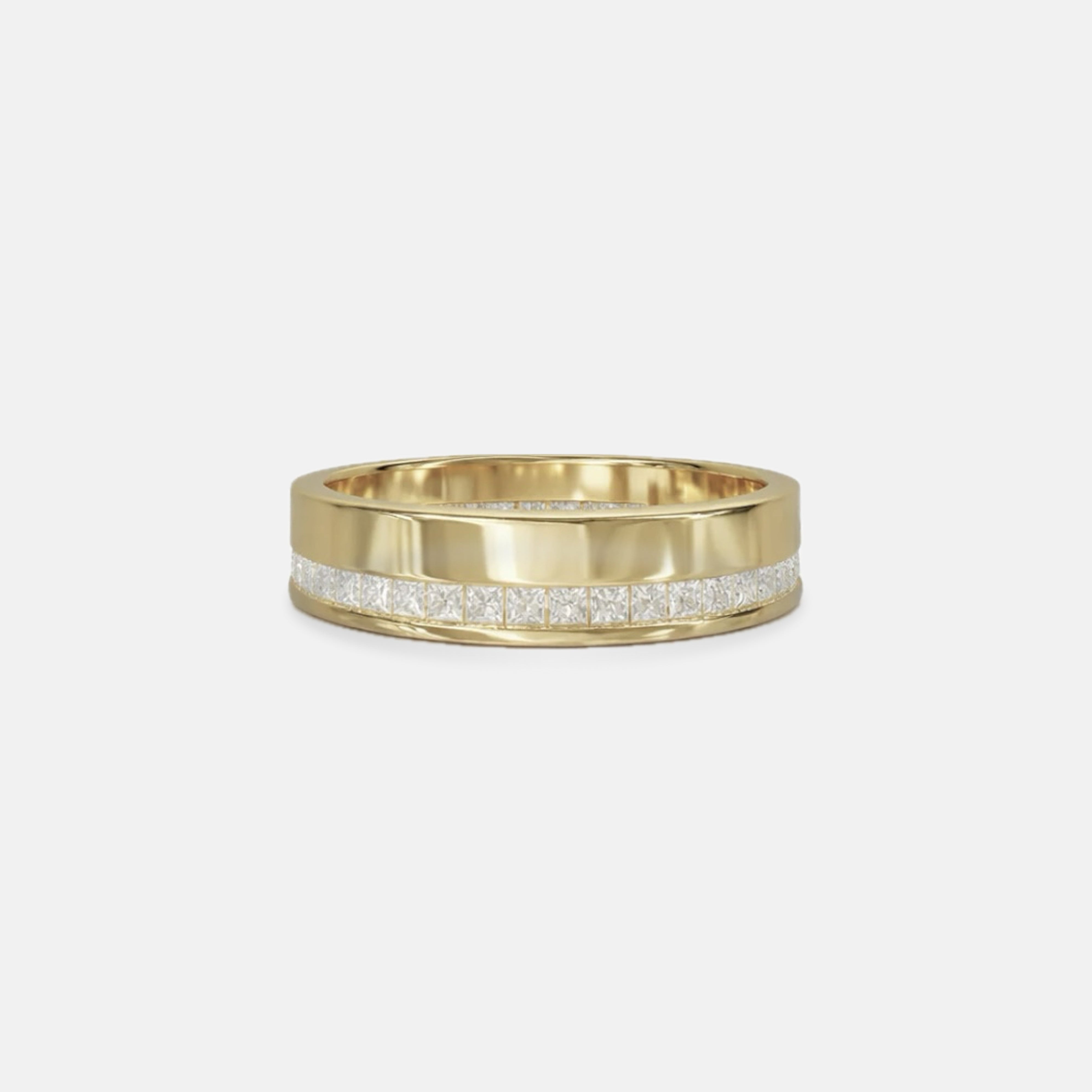 Gold ring with embedded diamonds on a light gray background