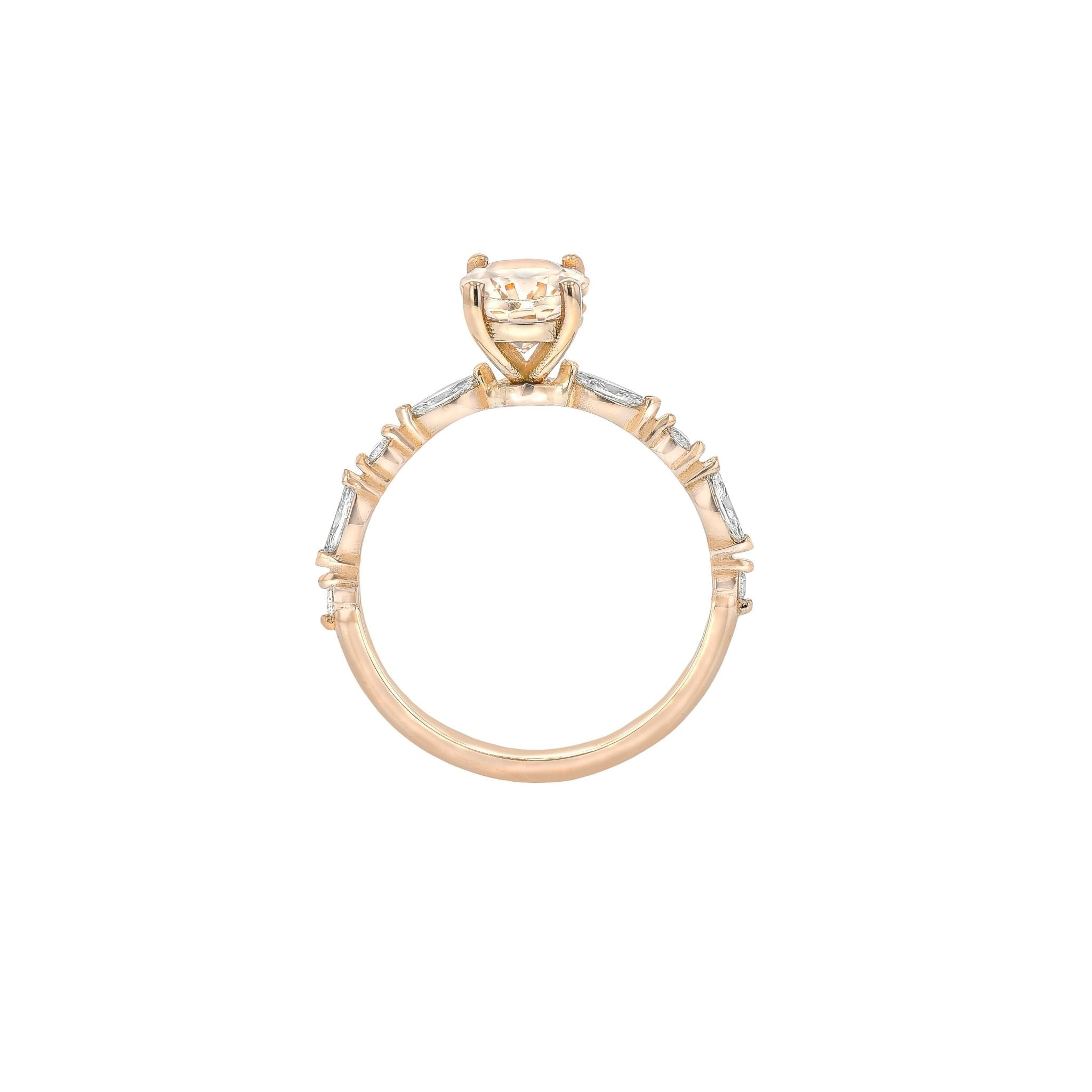 Rings-One of our most beloved designs. The Kelly features a stunning centre morganite surrounded by a band holding marquise and round-cut diamonds. This ring is a stunning reflection of love with its intricate design and endless sparkle. We recommend pairing the Kelly with the Eleni Diamond Band or the Eleanor Diamond Band. Product Details - Featuring a natural 8x6mm peachy-pinky Morganite centre stone- The ring is 2mm thick and 1.80mm wide - The side stones are marquise and round brilliant cut natural diam