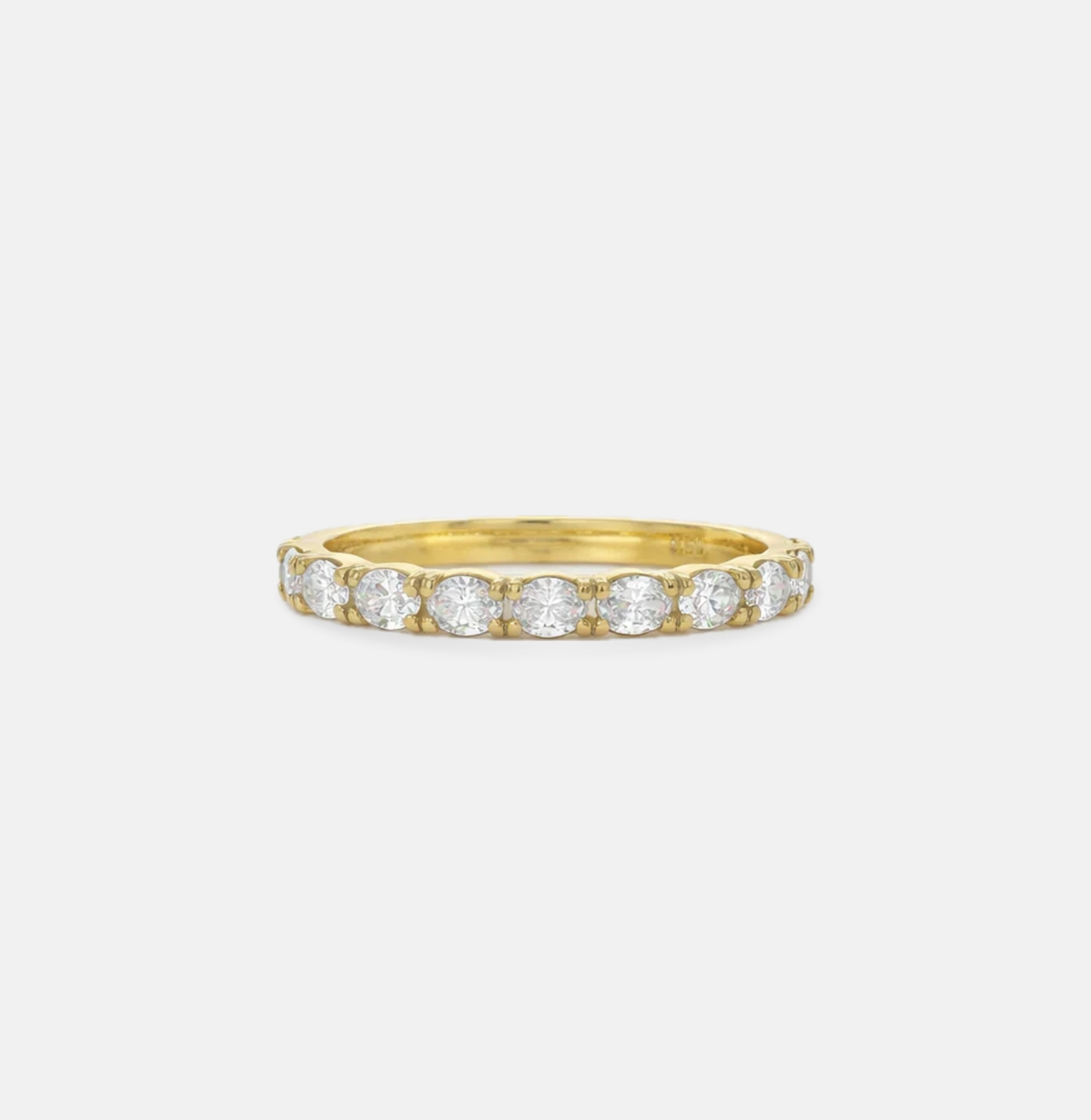 Gold ring with diamonds on a white background