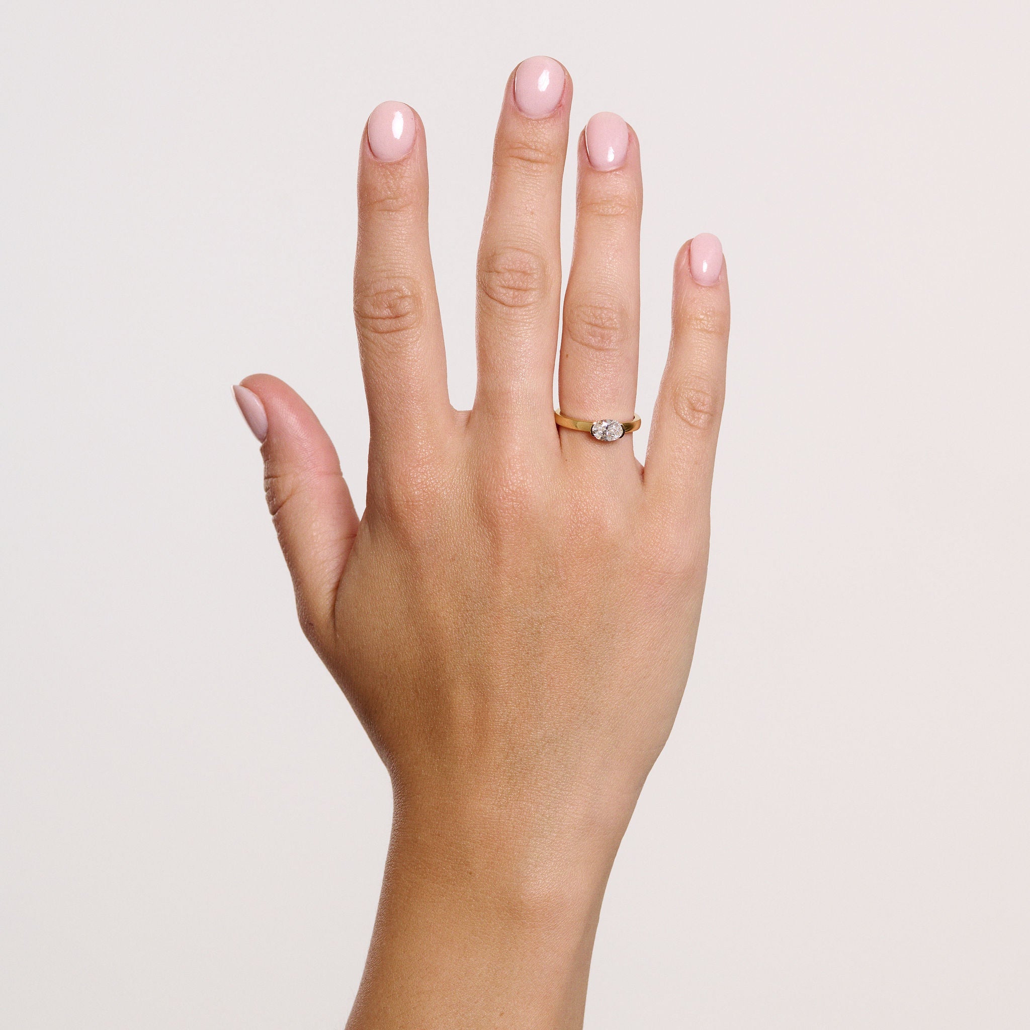 Rings-A contemporary take on the classic solitaire, the Margot is designed for the modern wearer. With an east-west set oval cut center diamond on a thick band, this ring is bold and sleek. See the Margot paired with the Josephine Luxe Diamond Band. Available with different size oval diamonds. Product images featuring an option with 1.00ct center diamond and 0.70ct diamond.-ELIISE MAAR JEWELLERY