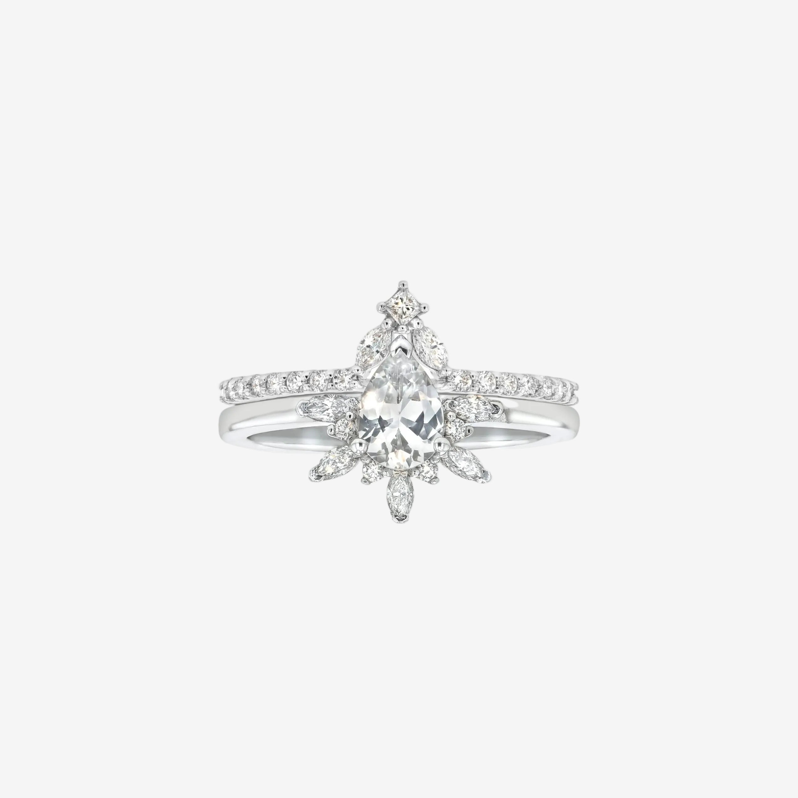 Rings-Feminine, nostalgic nod to the beauty, timelessness and grace of what it means to be woman. Centre stone is a stunning white sapphire completed with a divine diamond halo. Destined to be your forever obsession. Product Details - Features a 0.70ct natural white sapphire- Half halo features marquise and round F/SI1 natural diamonds (approximately 0.20ct)- Shop the Natasha Diamond Crown to complete the set- The ring is 1.85mm wide and 1.6mm thick-ELIISE MAAR JEWELLERY