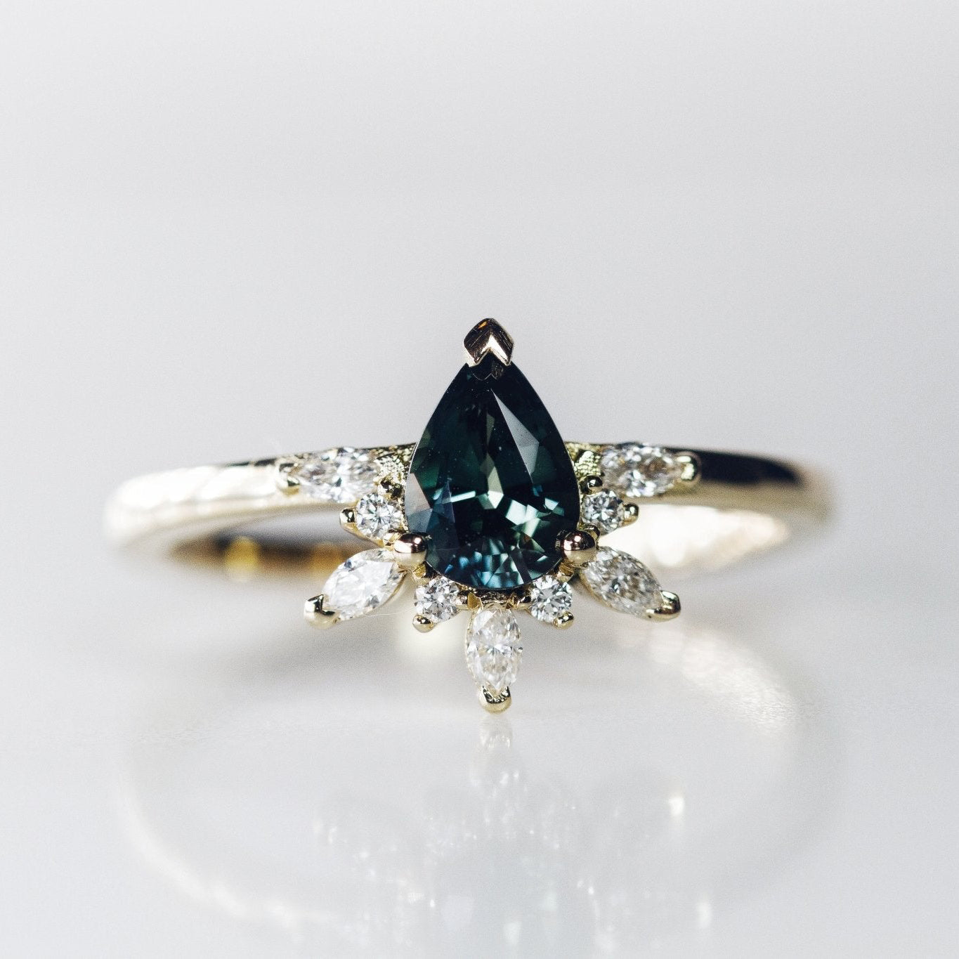 Rings-Feminine, nostalgic nod to the beauty, timelessness and grace of what it means to be woman. Centre stone is a stunning Australian Sapphire completed with a divine diamond halo. Destined to be your forever obsession. Product Details - Features a 0.70ct natural deep blue Australian Sapphire- Half halo features marquise and round F/SI1 natural diamonds (approximately 0.20ct)- Shop the Natasha Diamond Crown to complete the set- The ring is 1.85mm wide and 1.6mm thick-ELIISE MAAR JEWELLERY