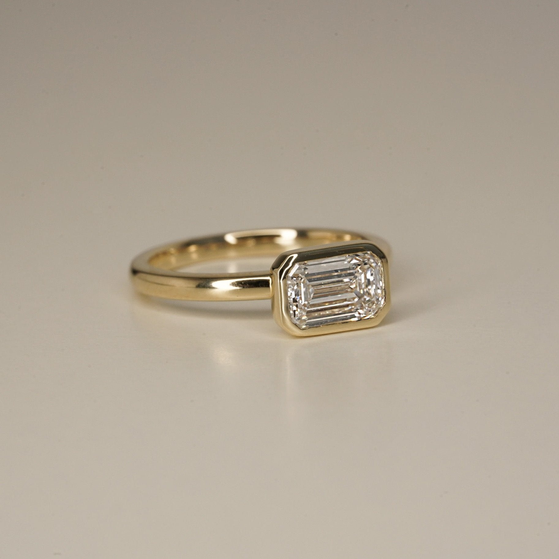 Rings-The Stephanie is truly effortless and timeless. The full bezel setting around the emerald cut diamond makes this ring unique and bold. Fall in love forever with this stunning design.-ELIISE MAAR JEWELLERY