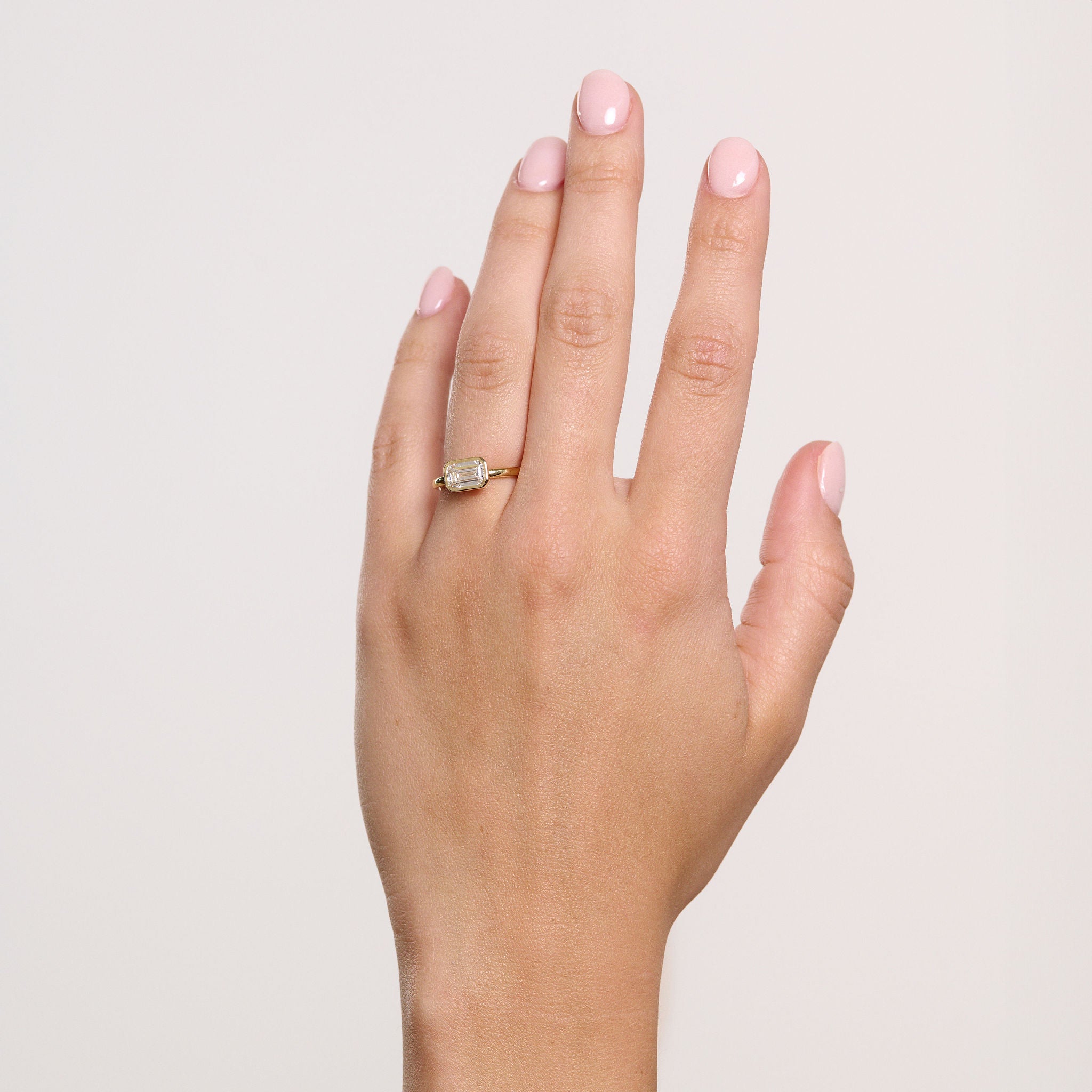 Rings-The Stephanie is truly effortless and timeless. The full bezel setting around the emerald cut diamond makes this ring unique and bold. Fall in love forever with this stunning design.-ELIISE MAAR JEWELLERY