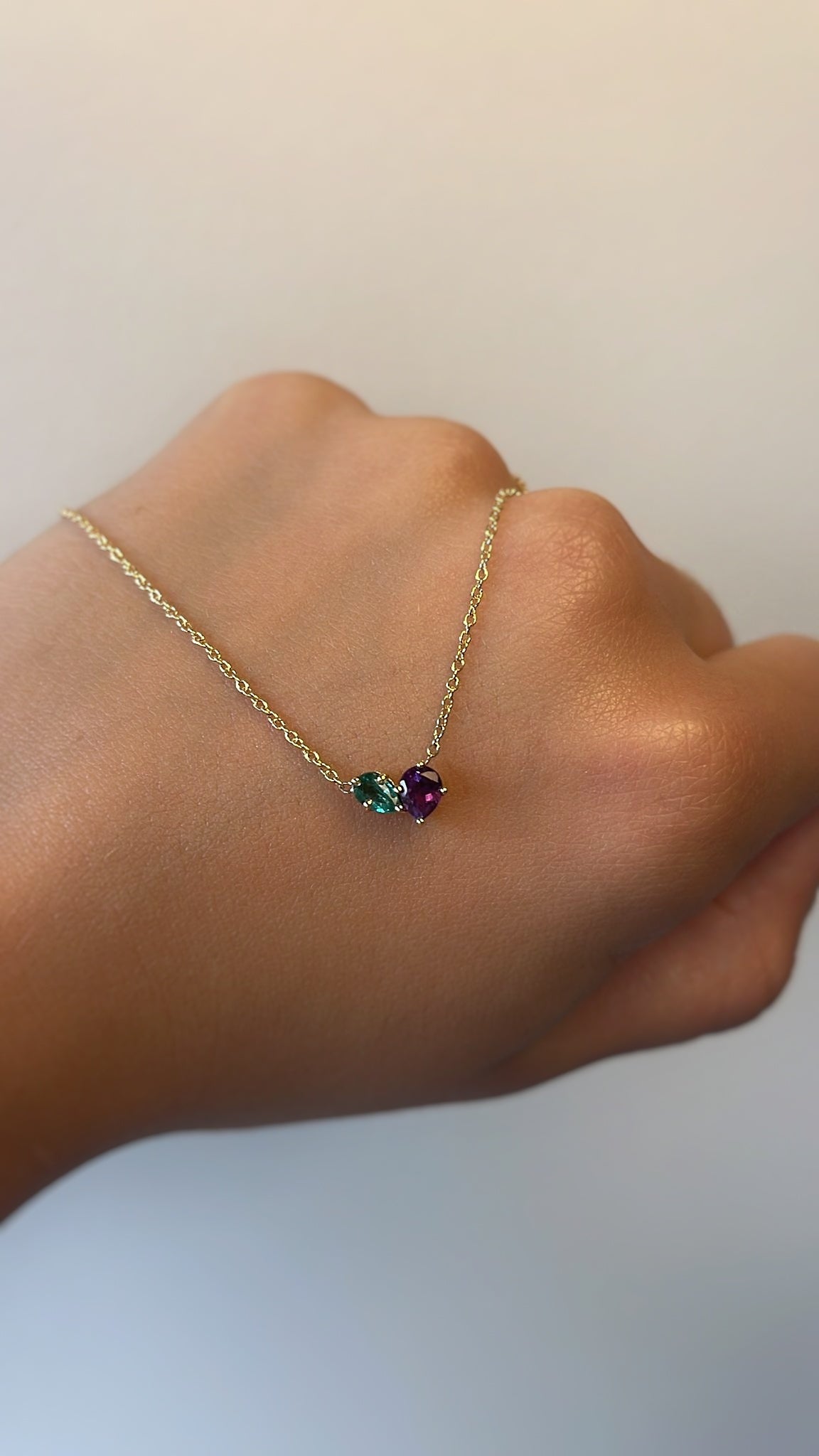 Necklaces-This enchanting heart shaped birthstone necklace looks like a spark of celestial beauty. Two individual, sparkling pear-shaped stones, customizable to each of your beloved's birth months. Luxe Necklace - Features 6x4 Pear Cut Gemstones (total carat weigh 1.00ct) JANUARY Garnet FEBRUARY Amethyst MARCH Aquamarine APRIL Diamond MAY Emerald JUNE Pearl JULY Ruby AUGUST Peridot SEPTEMBER Sapphire OCTOBER Tourmaline NOVEMBER Citrine DECEMBER Blue Topaz Whether worn as a reminder of someone special in you