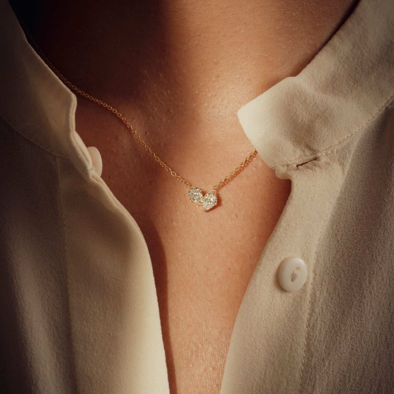 Necklaces-This enchanting heart shaped birthstone necklace looks like a spark of celestial beauty. Two individual, sparkling pear-shaped stones, customizable to each of your beloved's birth months. Luxe Necklace - Features 6x4 Pear Cut Gemstones (total carat weigh 1.00ct) JANUARY Garnet FEBRUARY Amethyst MARCH Aquamarine APRIL Diamond MAY Emerald JUNE Pearl JULY Ruby AUGUST Peridot SEPTEMBER Sapphire OCTOBER Tourmaline NOVEMBER Citrine DECEMBER Blue Topaz Whether worn as a reminder of someone special in you