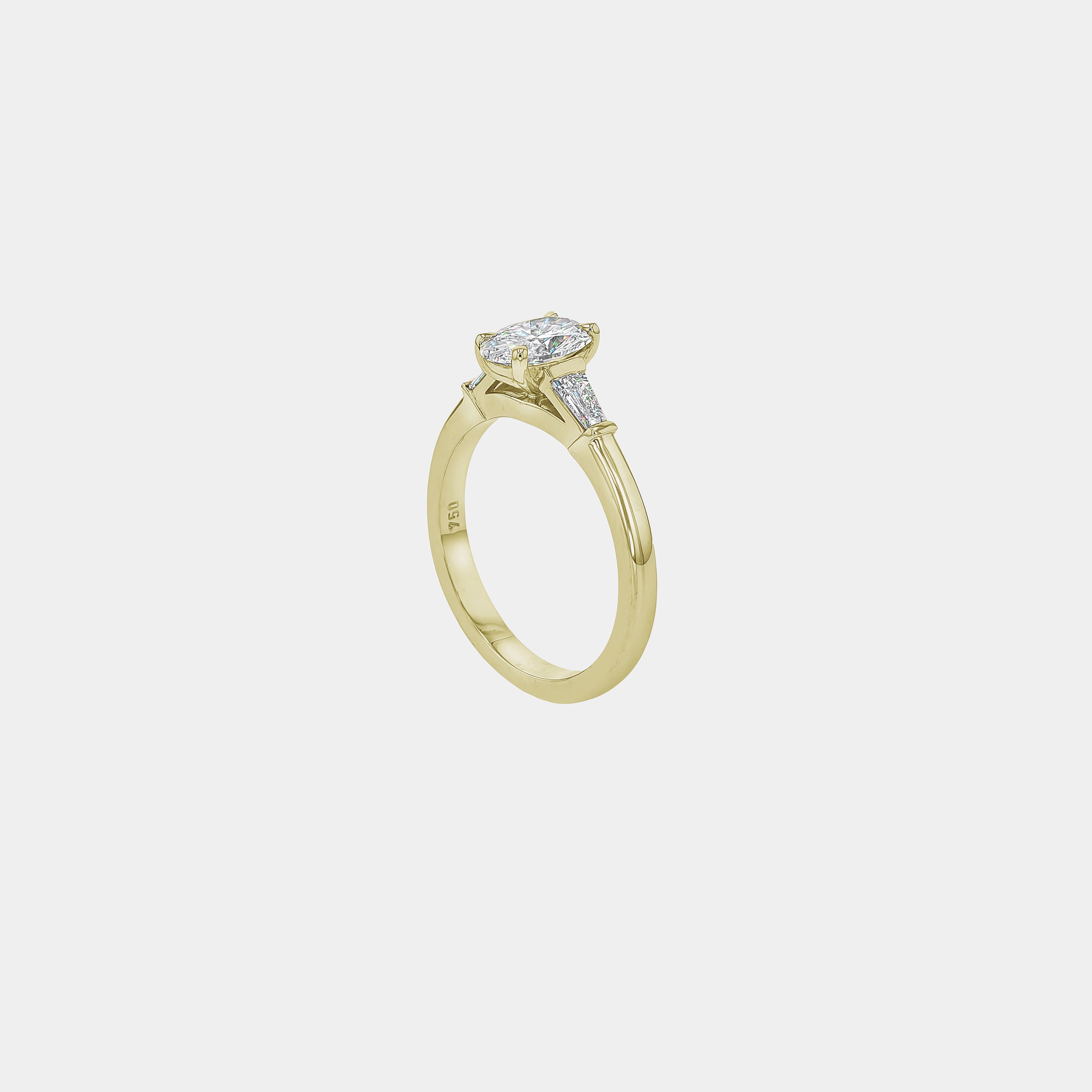 Rings-The Willow is a captivating engagement ring. The side tapered baguette cut stones create a beautiful crescendo to the centre oval cut diamond. The thicker band creates a ring that is structured and impactful. Shown paired with the Petite Nadia.-ELIISE MAAR JEWELLERY