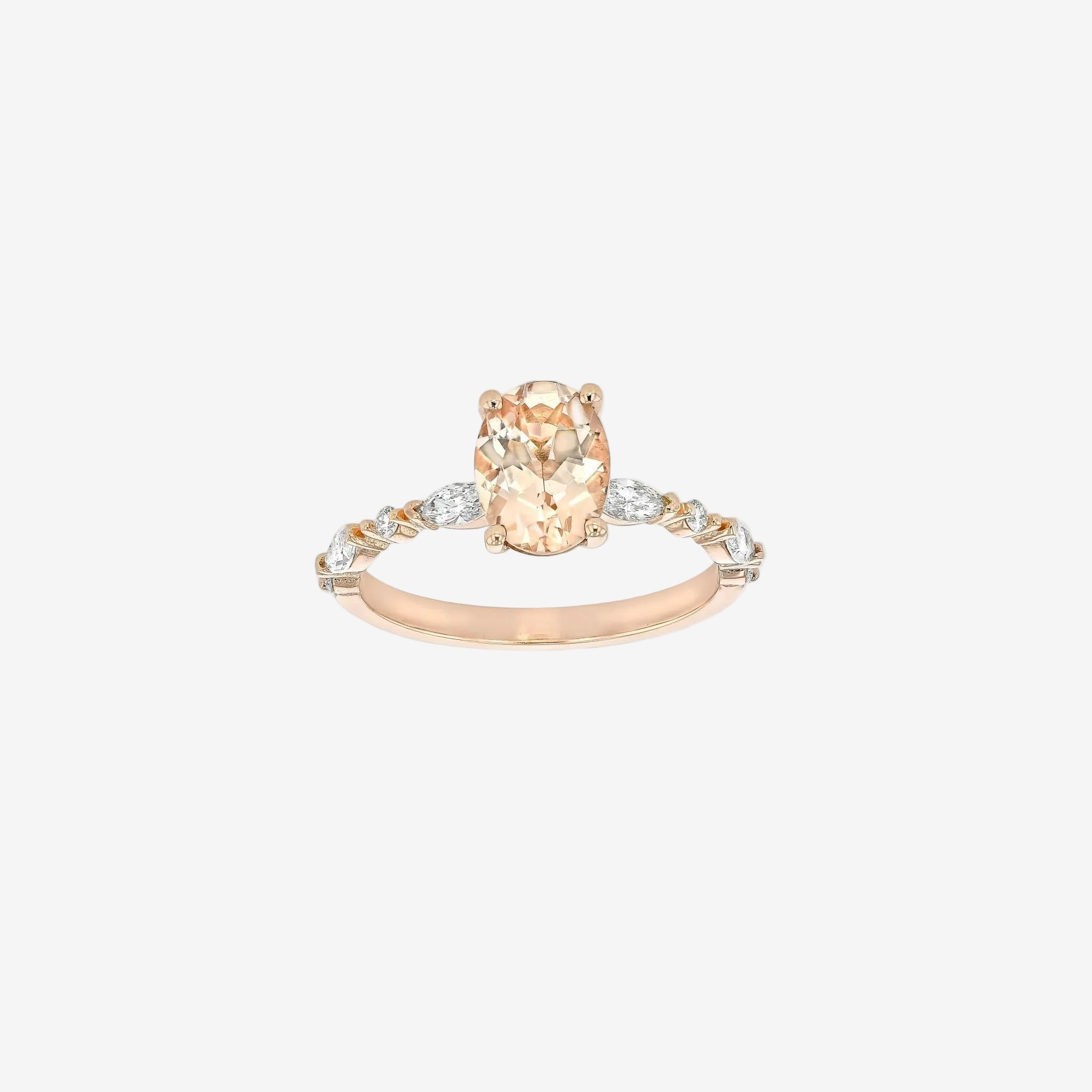 Rings-One of our most beloved designs. The Kelly features a stunning centre morganite surrounded by a band holding marquise and round-cut diamonds. This ring is a stunning reflection of love with its intricate design and endless sparkle. We recommend pairing the Kelly with the Eleni Diamond Band or the Eleanor Diamond Band. Product Details - Featuring a natural 8x6mm peachy-pinky Morganite centre stone- The ring is 2mm thick and 1.80mm wide - The side stones are marquise and round brilliant cut natural diam