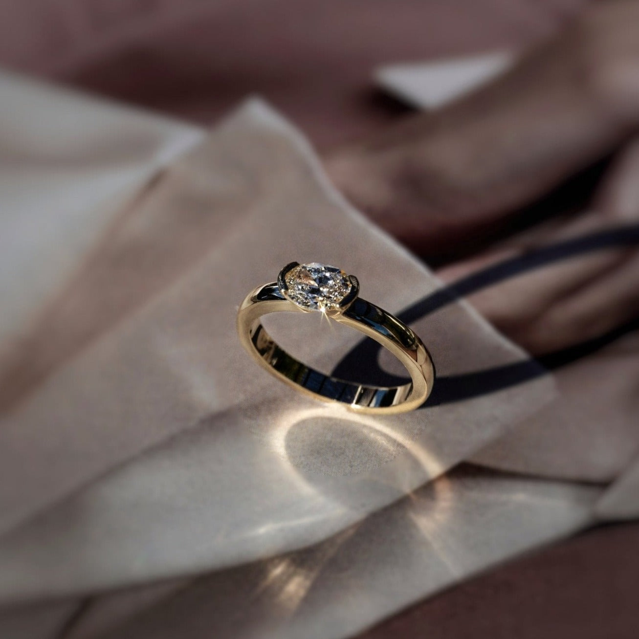 Rings-A contemporary take on the classic solitaire, the Margot is designed for the modern wearer. With an east-west set oval cut center diamond on a thick band, this ring is bold and sleek. See the Margot paired with the Josephine Luxe Diamond Band. Available with different size oval diamonds. Product images featuring an option with 1.00ct center diamond and 0.70ct diamond.-ELIISE MAAR JEWELLERY