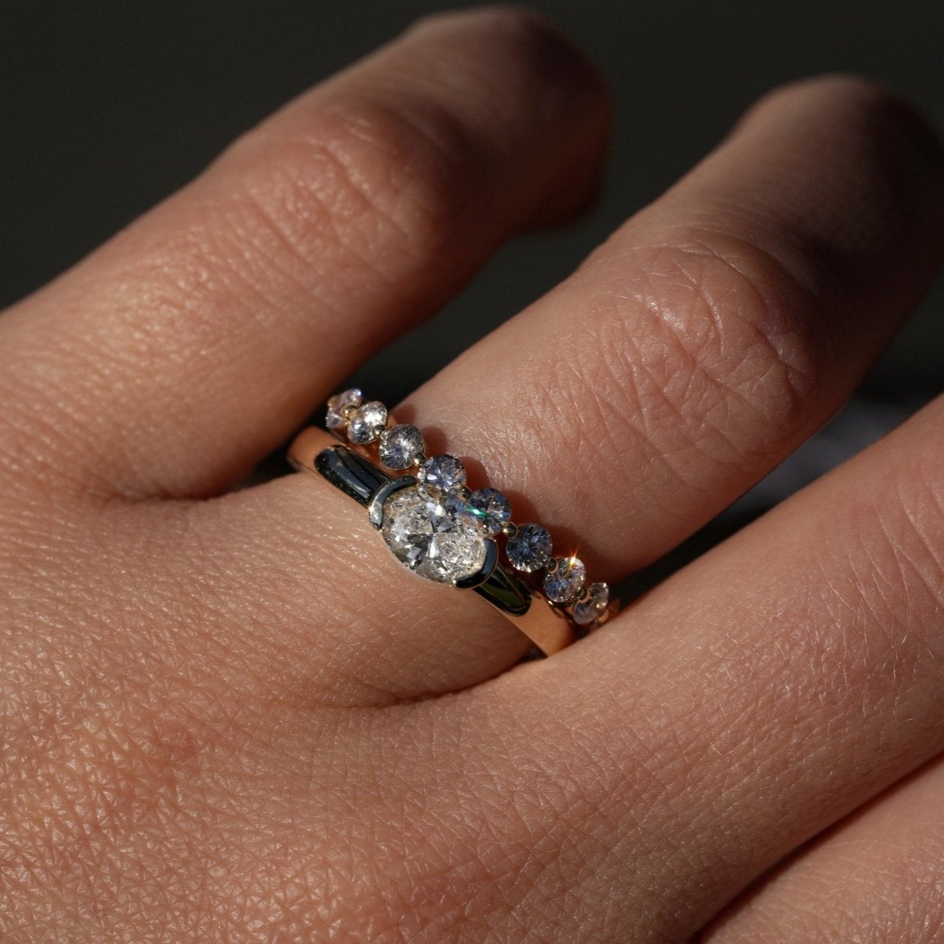 Rings-A contemporary take on the classic solitaire, the Margot is designed for the modern wearer. With an east-west set oval cut center diamond on a thick band, this ring is bold and sleek. See the Margot paired with the Josephine Luxe Diamond Band. Available with different size oval diamonds. Product images featuring an option with 1.00ct center diamond and 0.70ct diamond.-ELIISE MAAR JEWELLERY