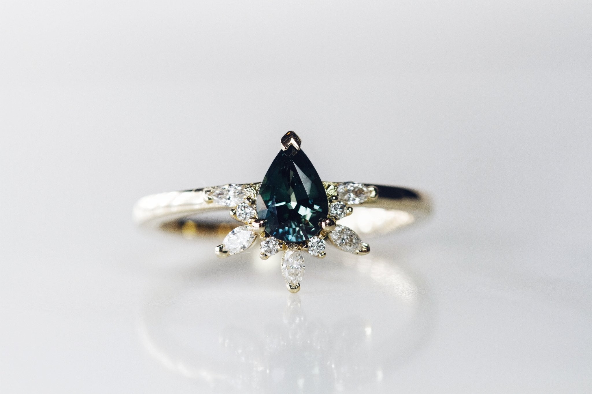 Rings-Feminine, nostalgic nod to the beauty, timelessness and grace of what it means to be woman. Centre stone is a stunning Australian Sapphire completed with a divine diamond halo. Destined to be your forever obsession. Product Details - Features a 0.70ct natural deep blue Australian Sapphire- Half halo features marquise and round F/SI1 natural diamonds (approximately 0.20ct)- Shop the Natasha Diamond Crown to complete the set- The ring is 1.85mm wide and 1.6mm thick-ELIISE MAAR JEWELLERY