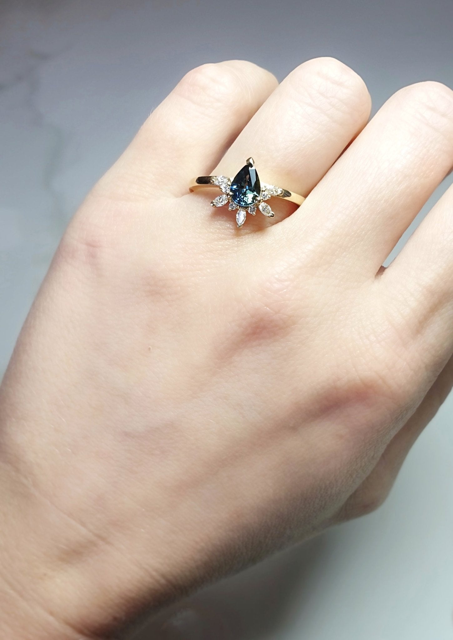 Rings-Feminine, nostalgic nod to the beauty, timelessness and grace of what it means to be woman. Centre stone is a stunning Australian Sapphire completed with a divine diamond halo. Destined to be your forever obsession. Product Details - Features a 0.70ct natural deep blue Australian Sapphire- Half halo features marquise and round F/SI1 natural diamonds (approximately 0.20ct)- Shop the Natasha Diamond Crown to complete the set- The ring is 1.85mm wide and 1.6mm thick-ELIISE MAAR JEWELLERY