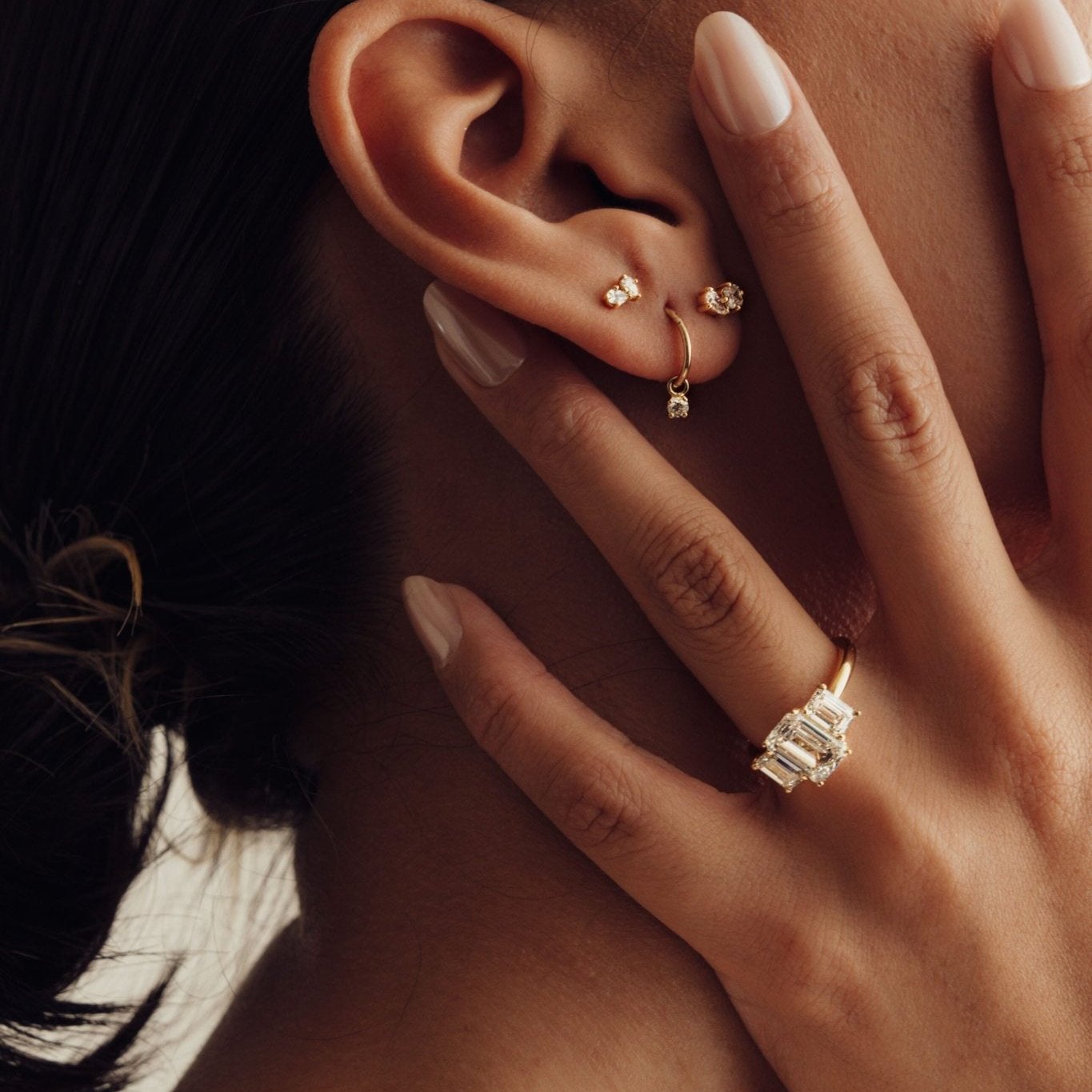 Rings-A stunning trilogy ring featuring three emerald-cut diamonds. Ethereal and breathtaking, this ring is a true testament to the beauty of the emerald-cut diamond. The step cut inside the emerald-cut diamond is famous for its large windows and flashes of bright white light. A ring where the quality and beauty of the diamonds cannot be ignored.-ELIISE MAAR JEWELLERY