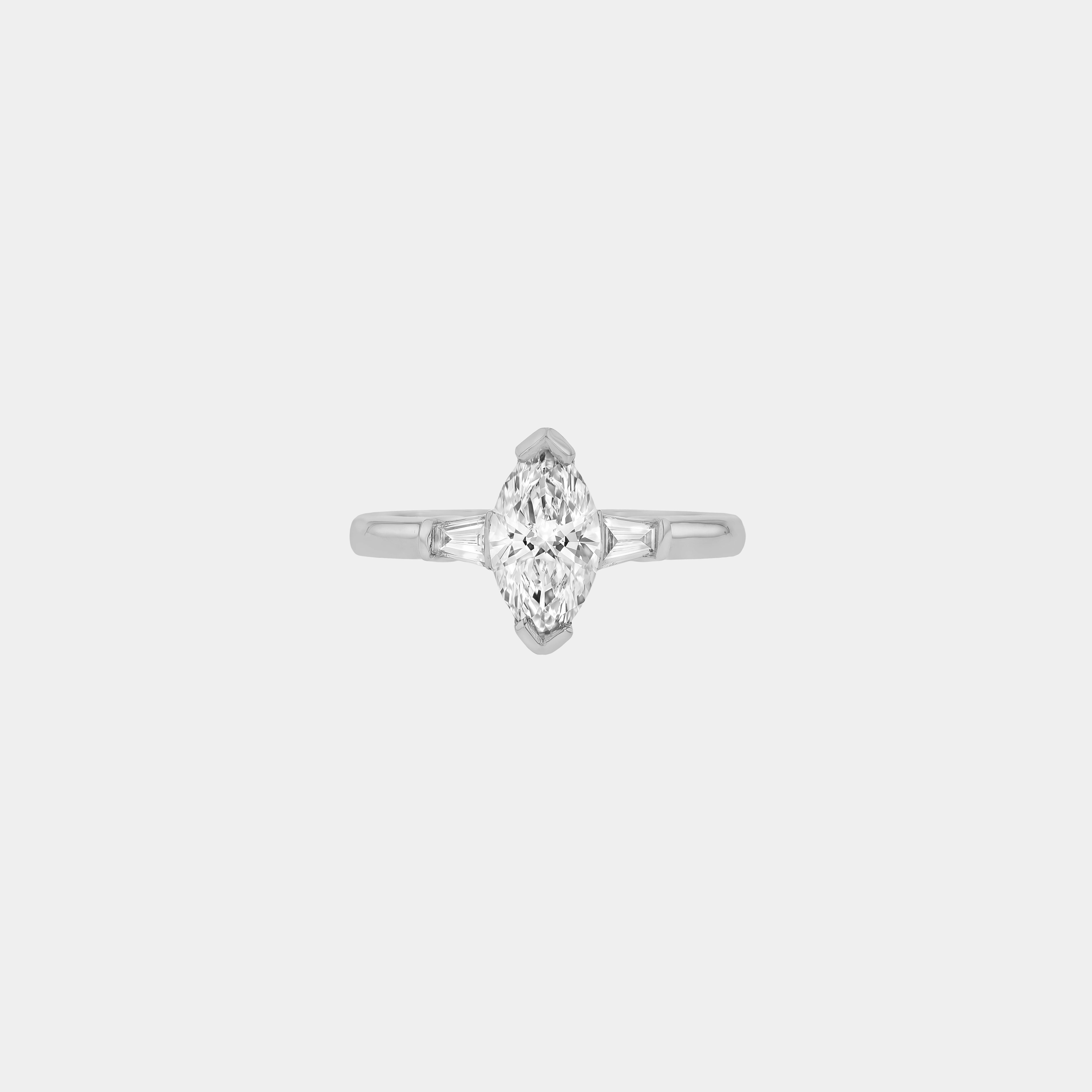 Rings-Your perfect art-deco dream. The striking beauty of the marquise diamond is the focus of this stunning engagement ring. The trilogy arrangement with the tapered baguettes on either side of the centre stone creates a crescendo of sparkling beauty. - VIDEO 1- VIDEO 2-ELIISE MAAR JEWELLERY