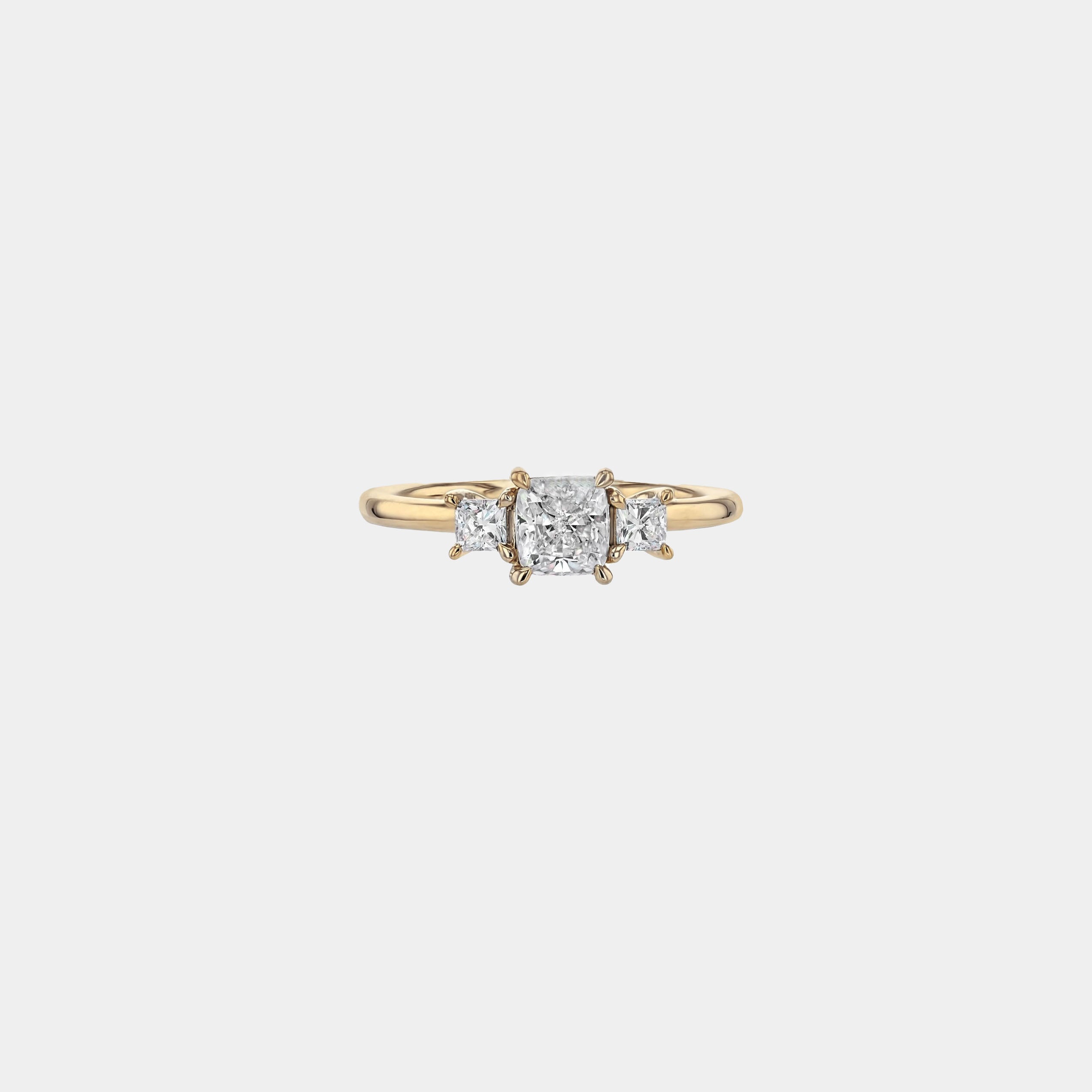 Rings-This elegant trilogy features a cushion cut centre diamond with a brilliant princess cut 0.30ct diamond on either side. VIDEO-ELIISE MAAR JEWELLERY