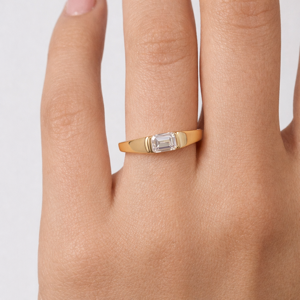 Rings-A modern and elegant signet band. Featuring an east-west half bezel set emerald cut diamond. This ring is the perfect understated engagement ring or striking signet band. Pair with the Petite Nadia Diamond Band for an elevated wedding set.-ELIISE MAAR JEWELLERY
