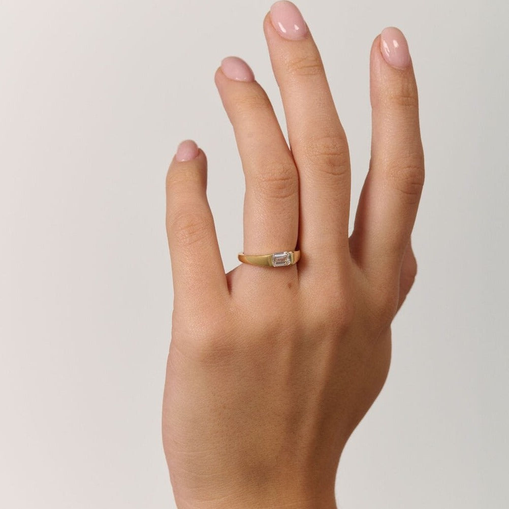 Rings-A modern and elegant signet band. Featuring an east-west half bezel set emerald cut diamond. This ring is the perfect understated engagement ring or striking signet band. Pair with the Petite Nadia Diamond Band for an elevated wedding set.-ELIISE MAAR JEWELLERY