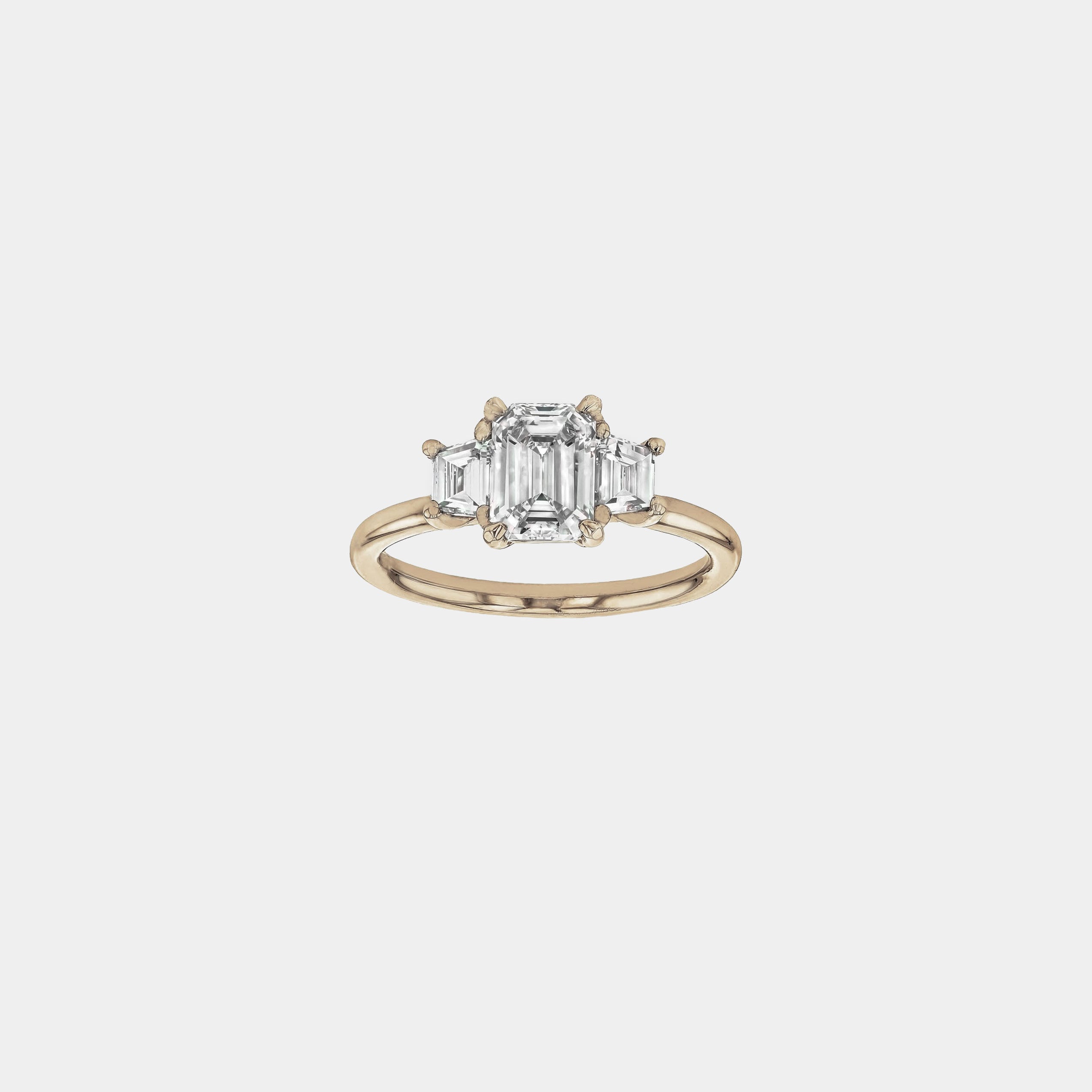 Rings-The Evangeline enhances the intriguing beauty of the emerald-cut diamond with the trapeze cut side stones. The trilogy creates a stunningly geometric shape that is modern and timeless. With the high setting of the stones this engagement ring sits flush with all wedding bands, we recommend pairing with the Bamboo and the Petite Nadia.-ELIISE MAAR JEWELLERY