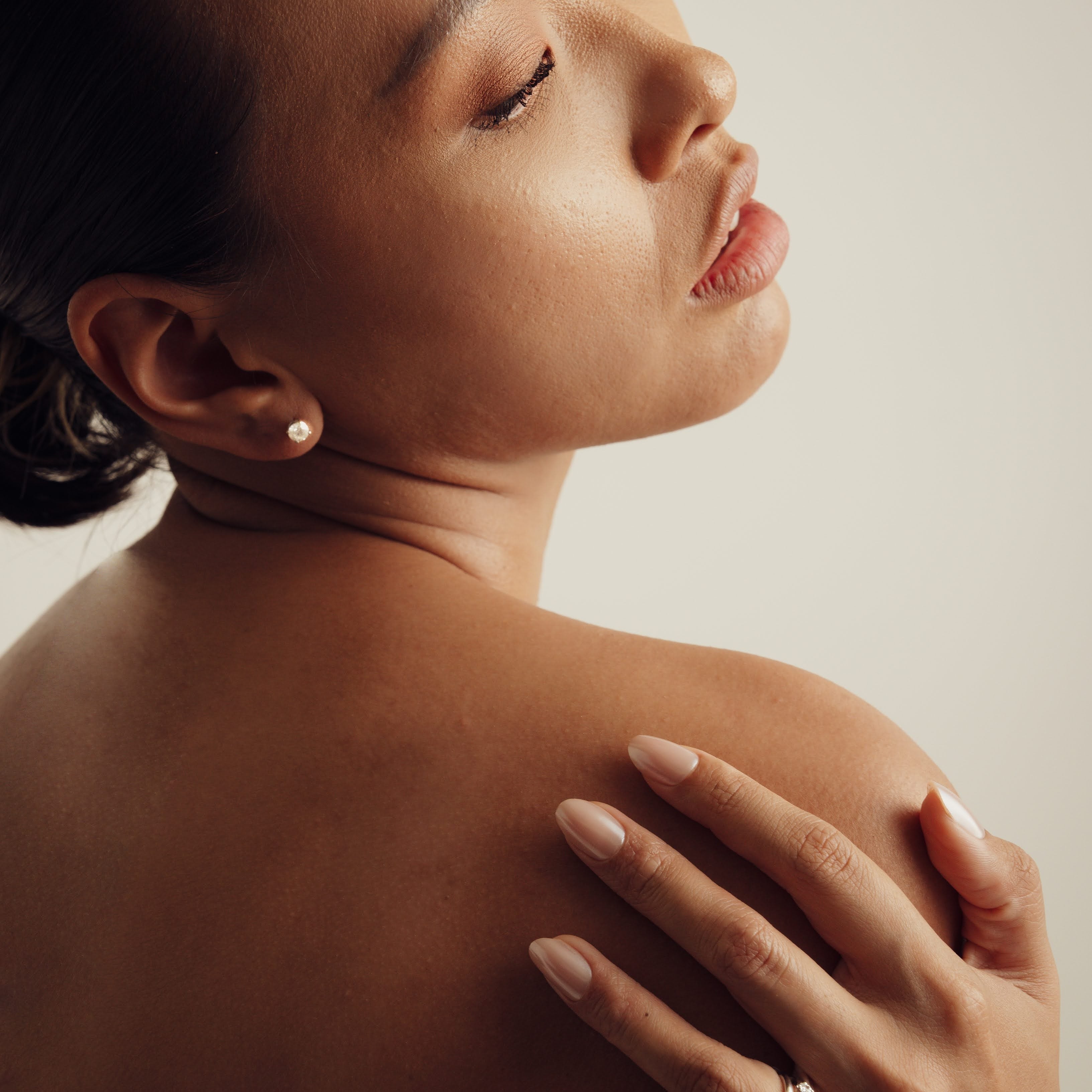 Rings-Drawing inspiration from Grace Kelly, this solitaire ring embodies timeless elegance. Featuring a 4-claw setting and a smoothly rounded band, it offers a subtle frame that highlights the radiant oval diamond at its center. An ideal engagement ring, it complements any wedding band to form a distinctive and personalized set. Shown paired with the 4.0mm Ceremonial Square Band and the Eleanor Luxe Diamond Band.-ELIISE MAAR JEWELLERY