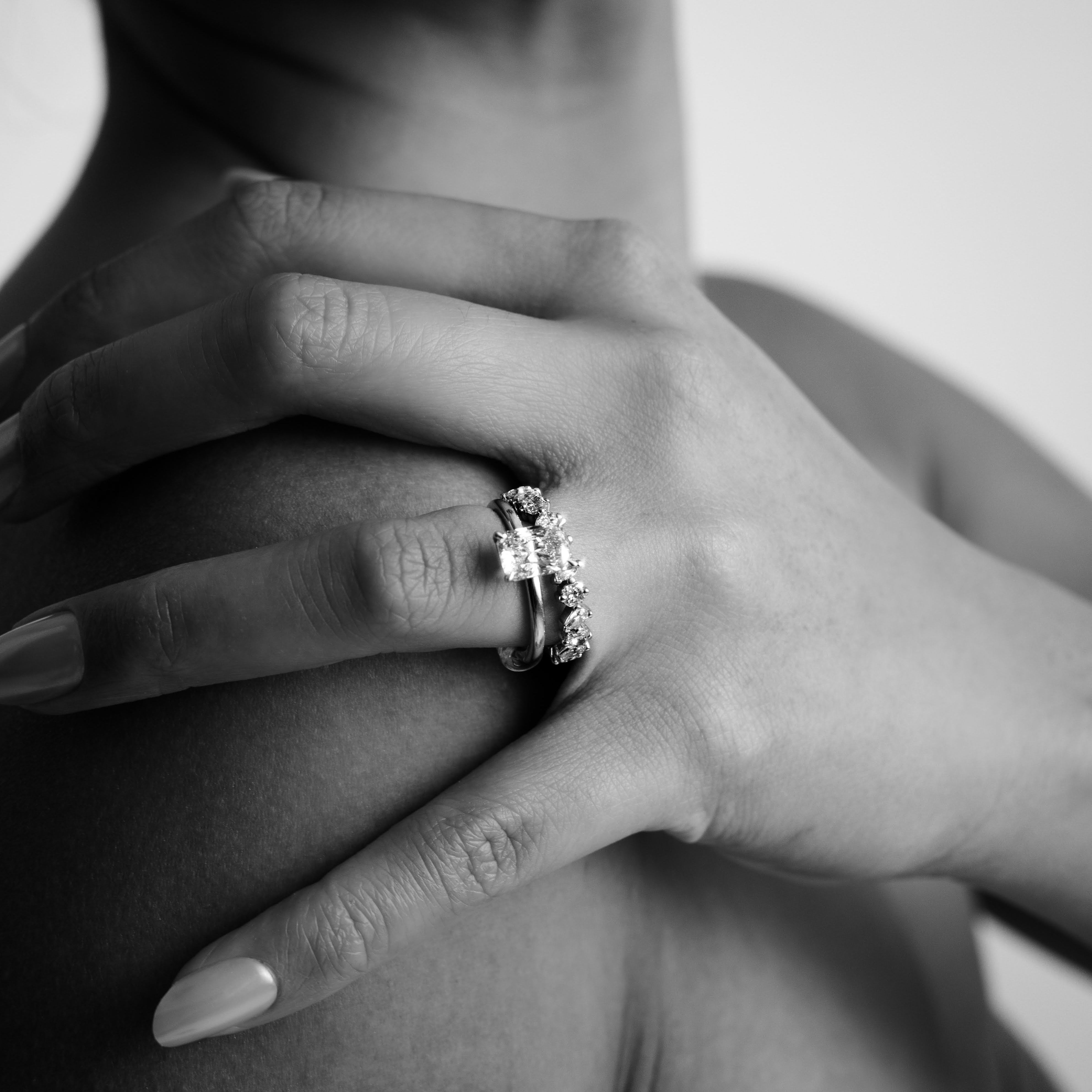 Rings-Drawing inspiration from Grace Kelly, this solitaire ring embodies timeless elegance. Featuring a 4-claw setting and a smoothly rounded band, it offers a subtle frame that highlights the radiant oval diamond at its center. An ideal engagement ring, it complements any wedding band to form a distinctive and personalized set. Shown paired with the 4.0mm Ceremonial Square Band and the Eleanor Luxe Diamond Band.-ELIISE MAAR JEWELLERY