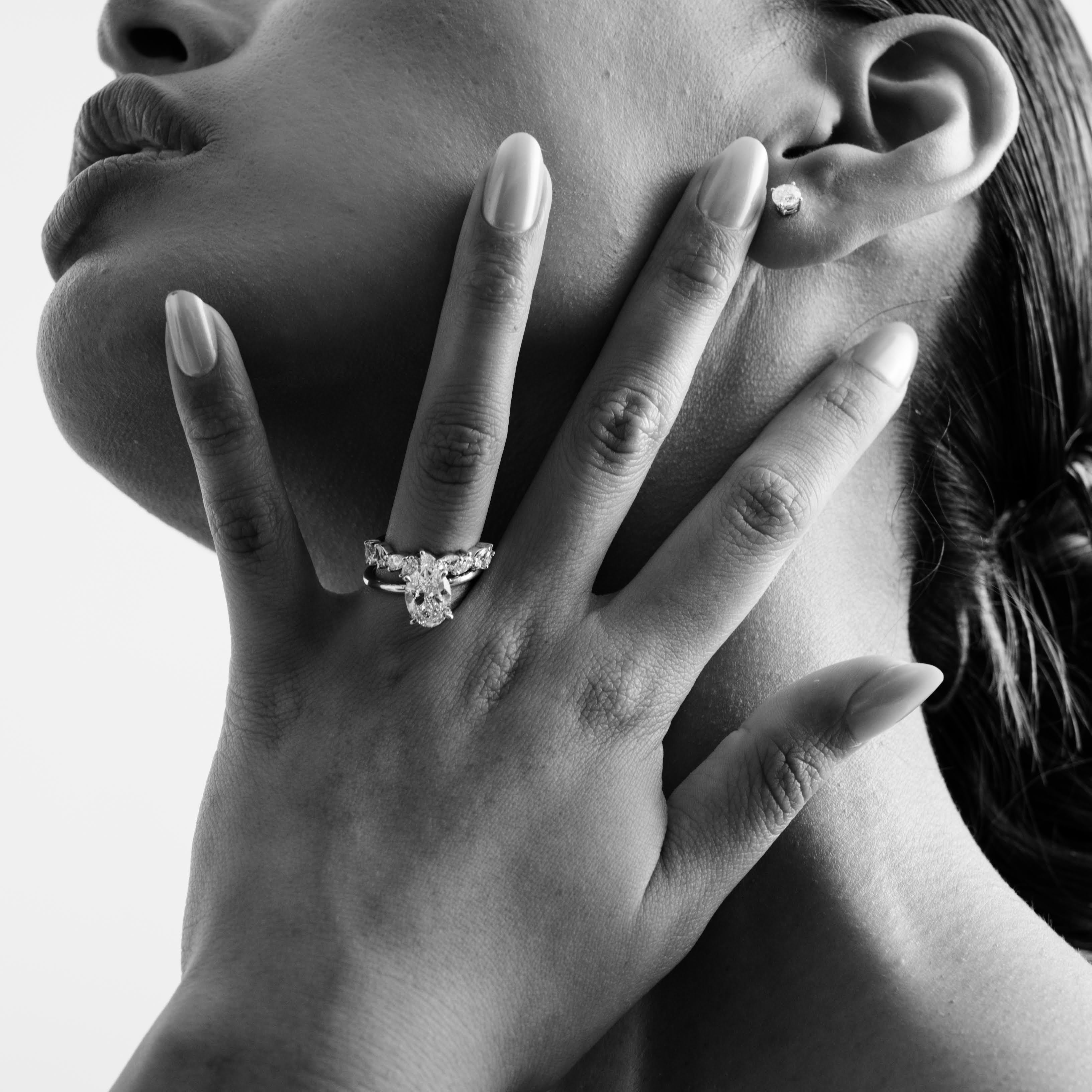 Rings-Drawing inspiration from Grace Kelly, this solitaire ring embodies timeless elegance. Featuring a 4-claw setting and a smoothly rounded band, it offers a subtle frame that highlights the radiant oval diamond at its center. An ideal engagement ring, it complements any wedding band to form a distinctive and personalized set. Shown paired with the 4.0mm Ceremonial Square Band and the Eleanor Luxe Diamond Band.-ELIISE MAAR JEWELLERY