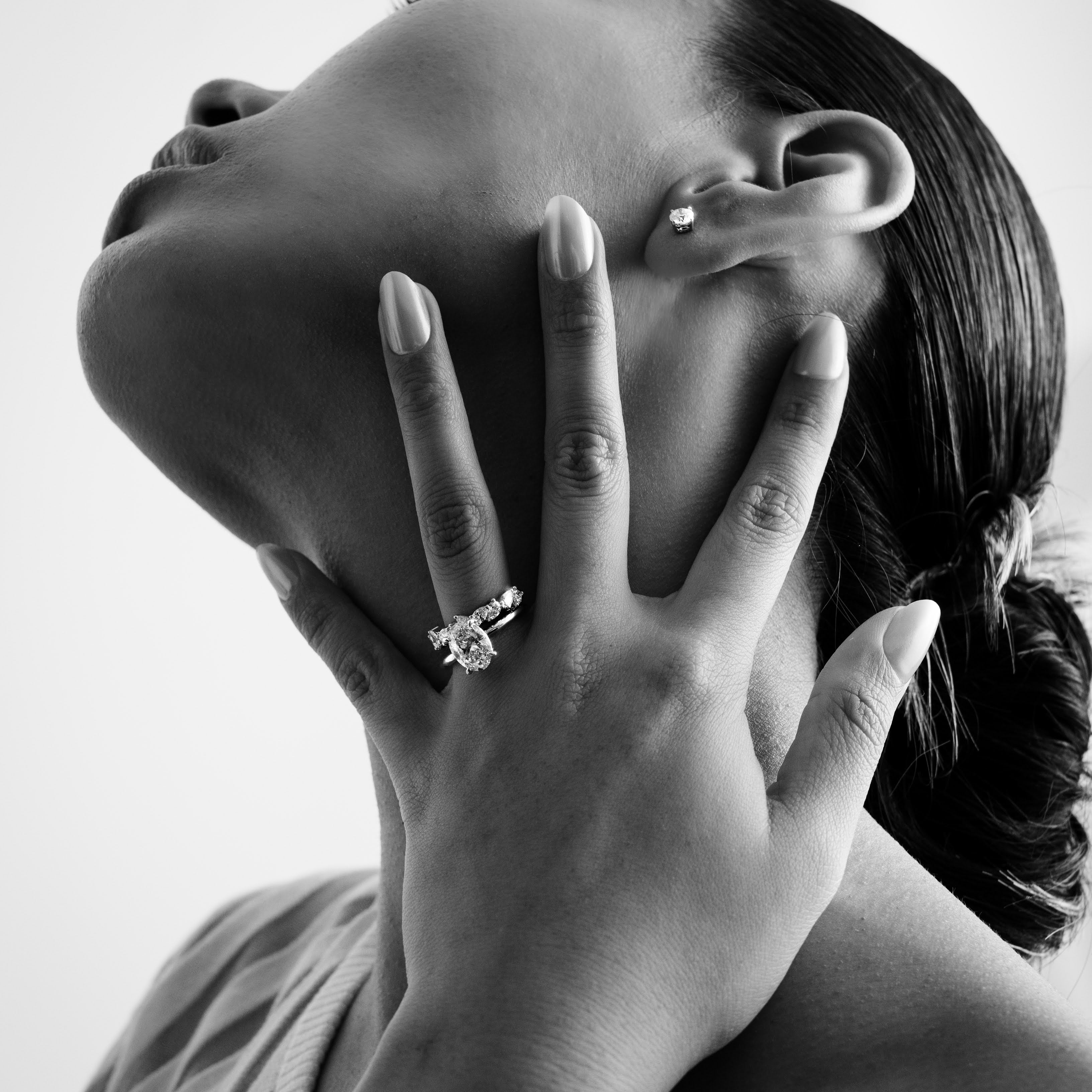 Rings-Drawing inspiration from Grace Kelly, this solitaire ring embodies timeless elegance. Featuring a 4-claw setting and a smoothly rounded band, it offers a subtle frame that highlights the radiant oval diamond at its center. An ideal engagement ring, it complements any wedding band to form a distinctive and personalized set. Shown paired with the 4.0mm Ceremonial Square Band and the Eleanor Luxe Diamond Band.-ELIISE MAAR JEWELLERY