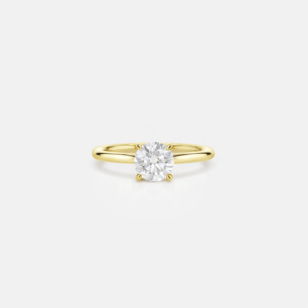 Gold ring with a diamond on a white background