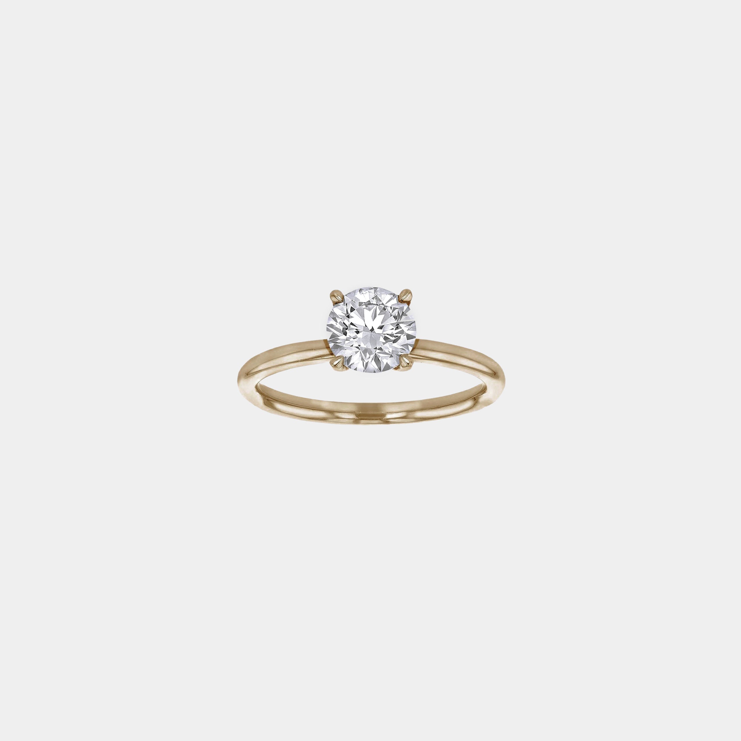 Rings-An elevated solitaire. With a beautiful round cut centre stone and hidden halo on the girdle of the 4 claw basket. The hidden halo provides a beautiful added sparkle to the ring from all angles without interfering with the power of the centre stone. This ring pairs beautifully with wedding bands, we recommend trying the Petite Josephine and the Eleanor.-ELIISE MAAR JEWELLERY