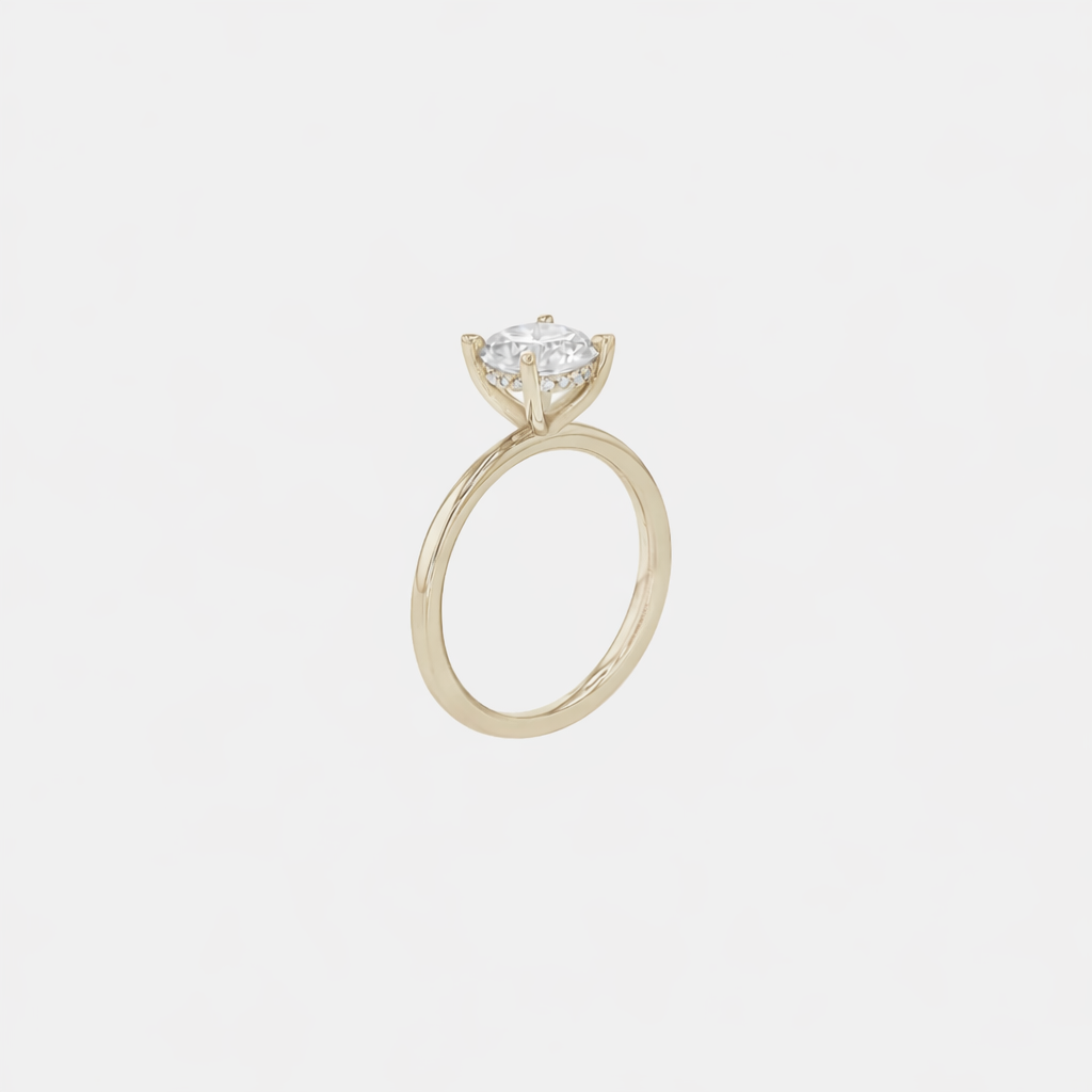 Rings-An elevated solitaire. With a beautiful round cut centre stone and hidden halo on the girdle of the 4 claw basket. The hidden halo provides a beautiful added sparkle to the ring from all angles without interfering with the power of the centre stone. This ring pairs beautifully with wedding bands, we recommend trying the Petite Josephine and the Eleanor.-ELIISE MAAR JEWELLERY