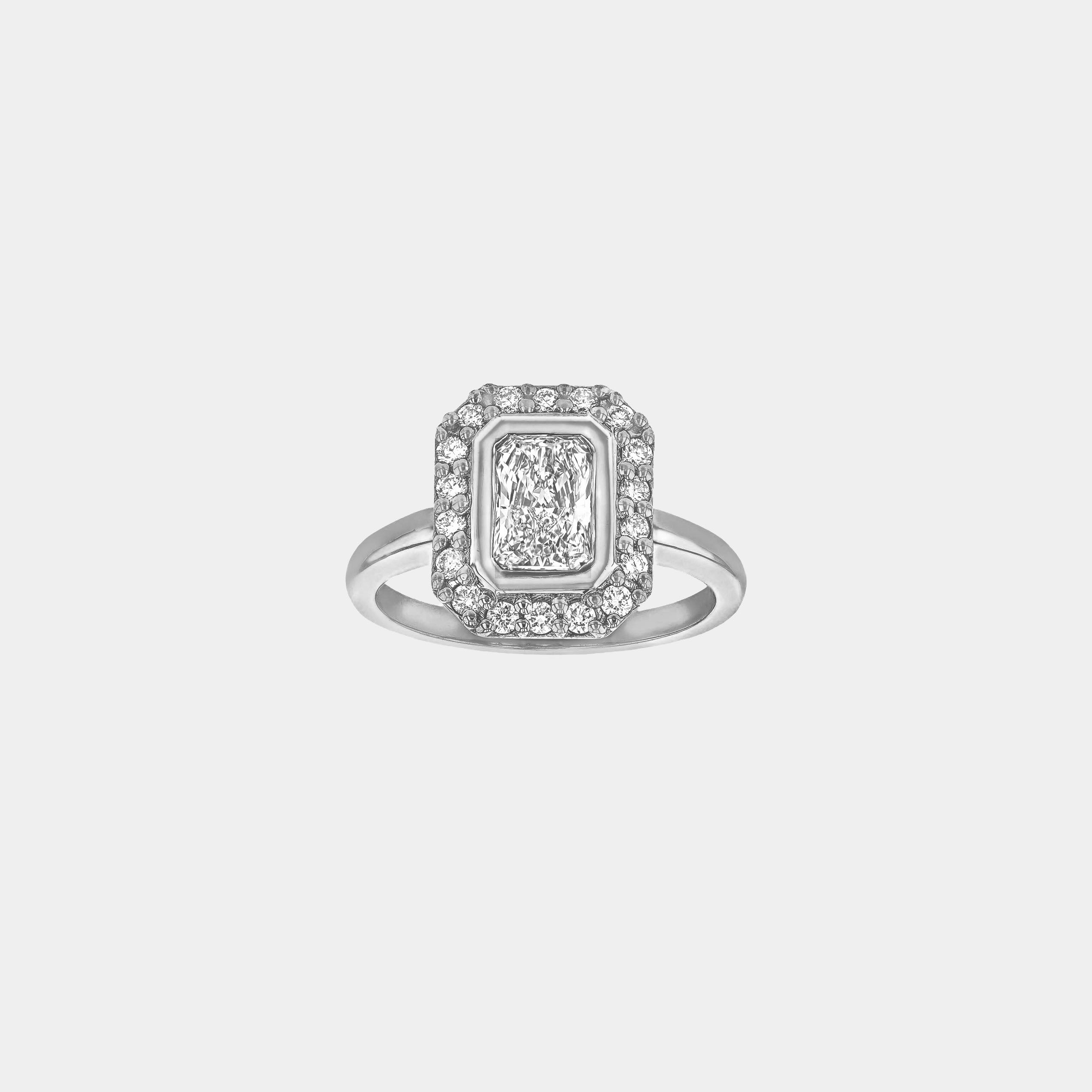Rings-A contemporary take on an art-deco design. The Holly boasts a stunning bezel set radiant cut centre diamond adorned by a striking halo. This ring uses and enhances the metal in which the stones are set in to create a design that is powerful and elegant.-ELIISE MAAR JEWELLERY