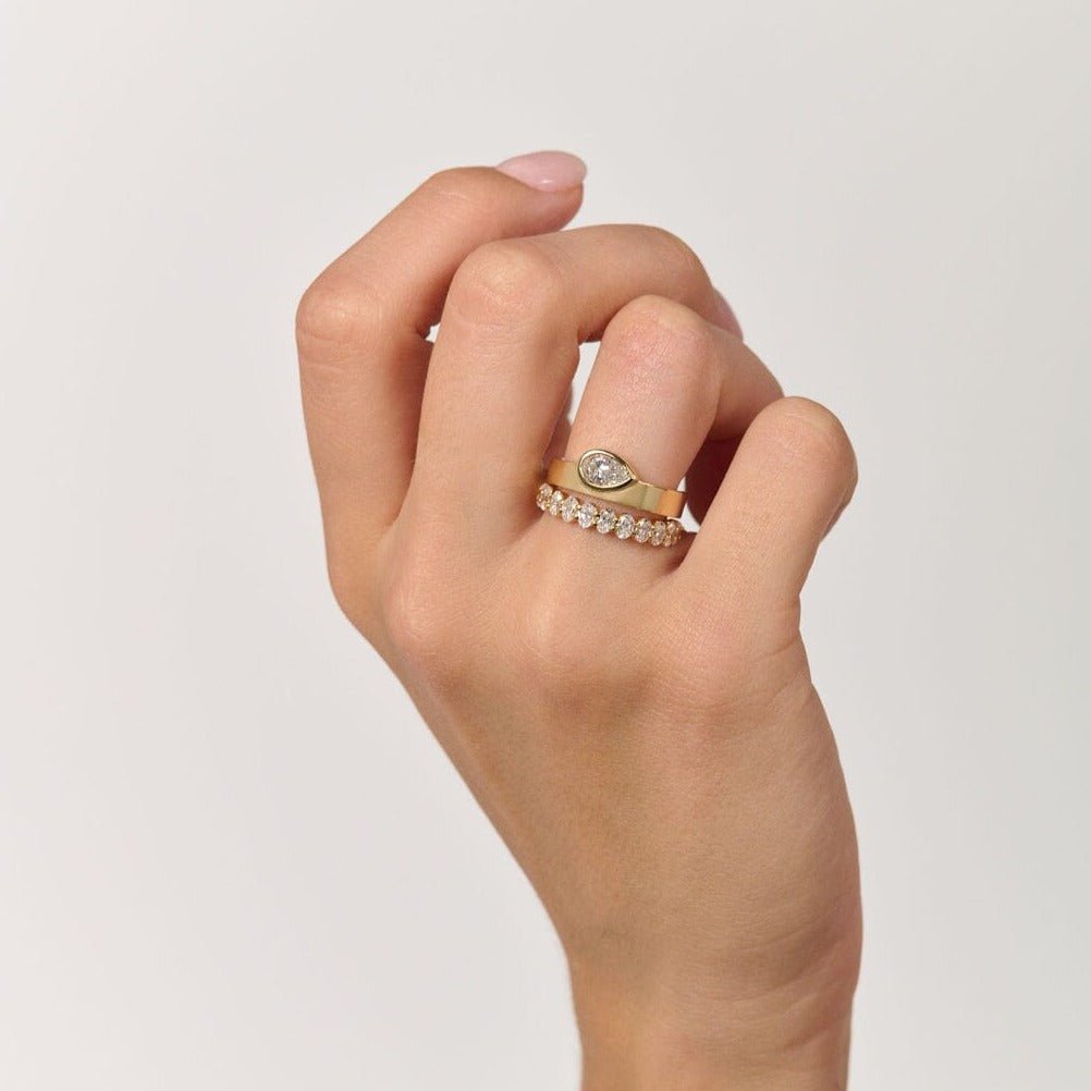 Rings-The Kali draws inspiration from her namesake Hindu goddess of time, change, creation and power. Known as being a defender of innocence Kali is a force to be reckoned with. The striking pear cut stone set in the thick band represents the divine female power that Kali embodies.-ELIISE MAAR JEWELLERY