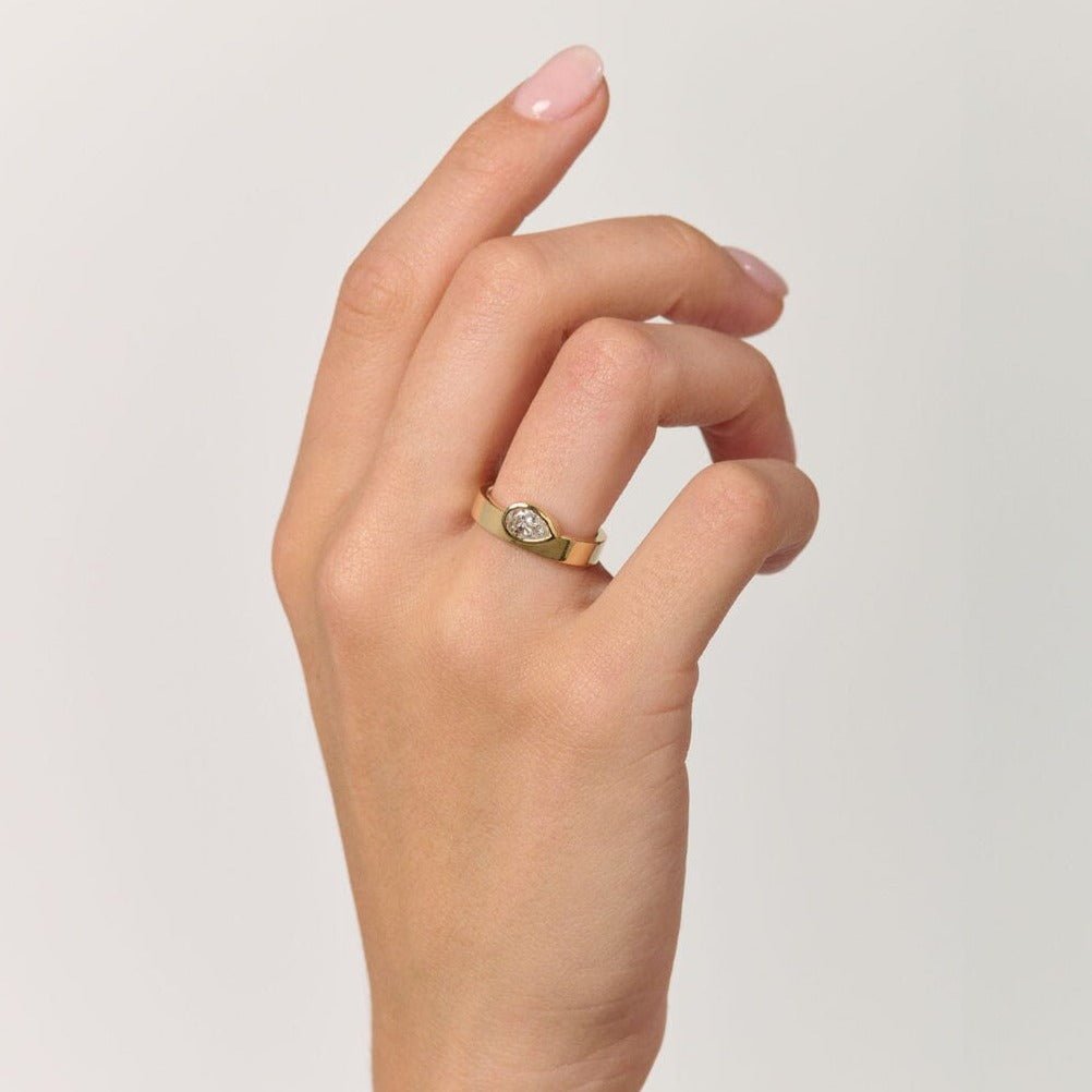 Rings-The Kali draws inspiration from her namesake Hindu goddess of time, change, creation and power. Known as being a defender of innocence Kali is a force to be reckoned with. The striking pear cut stone set in the thick band represents the divine female power that Kali embodies.-ELIISE MAAR JEWELLERY