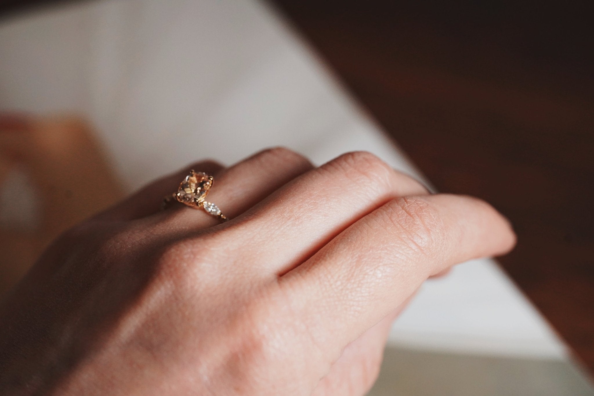 Rings-One of our most beloved designs. The Kelly features a stunning centre morganite surrounded by a band holding marquise and round-cut diamonds. This ring is a stunning reflection of love with its intricate design and endless sparkle. We recommend pairing the Kelly with the Eleni Diamond Band or the Eleanor Diamond Band. Product Details - Featuring a natural 8x6mm peachy-pinky Morganite centre stone- The ring is 2mm thick and 1.80mm wide - The side stones are marquise and round brilliant cut natural diam