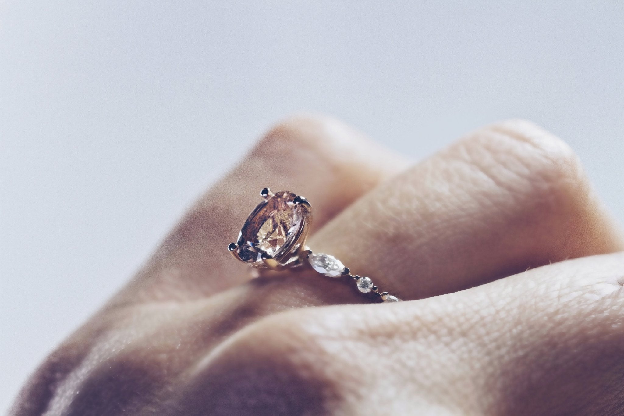 Rings-One of our most beloved designs. The Kelly features a stunning centre morganite surrounded by a band holding marquise and round-cut diamonds. This ring is a stunning reflection of love with its intricate design and endless sparkle. We recommend pairing the Kelly with the Eleni Diamond Band or the Eleanor Diamond Band. Product Details - Featuring a natural 8x6mm peachy-pinky Morganite centre stone- The ring is 2mm thick and 1.80mm wide - The side stones are marquise and round brilliant cut natural diam