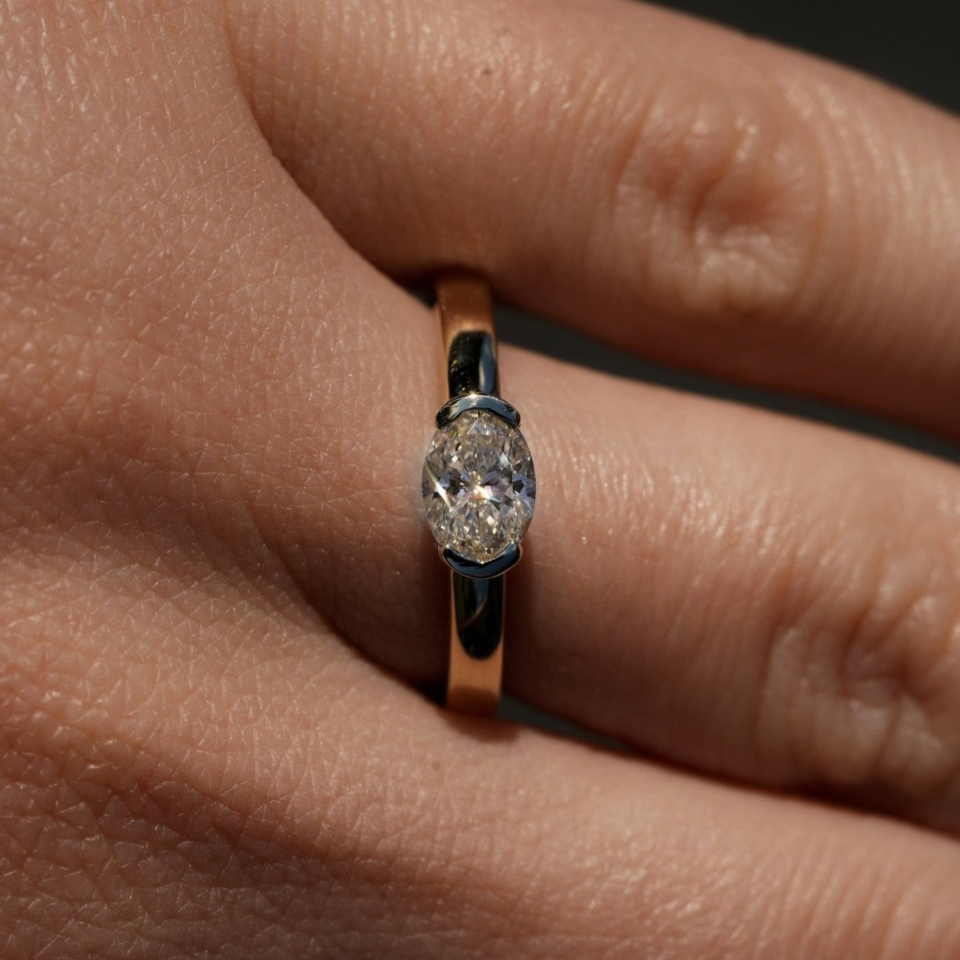 Rings-A contemporary take on the classic solitaire, the Margot is designed for the modern wearer. With an east-west set oval cut center diamond on a thick band, this ring is bold and sleek. See the Margot paired with the Josephine Luxe Diamond Band. Available with different size oval diamonds. Product images featuring an option with 1.00ct center diamond and 0.70ct diamond.-ELIISE MAAR JEWELLERY