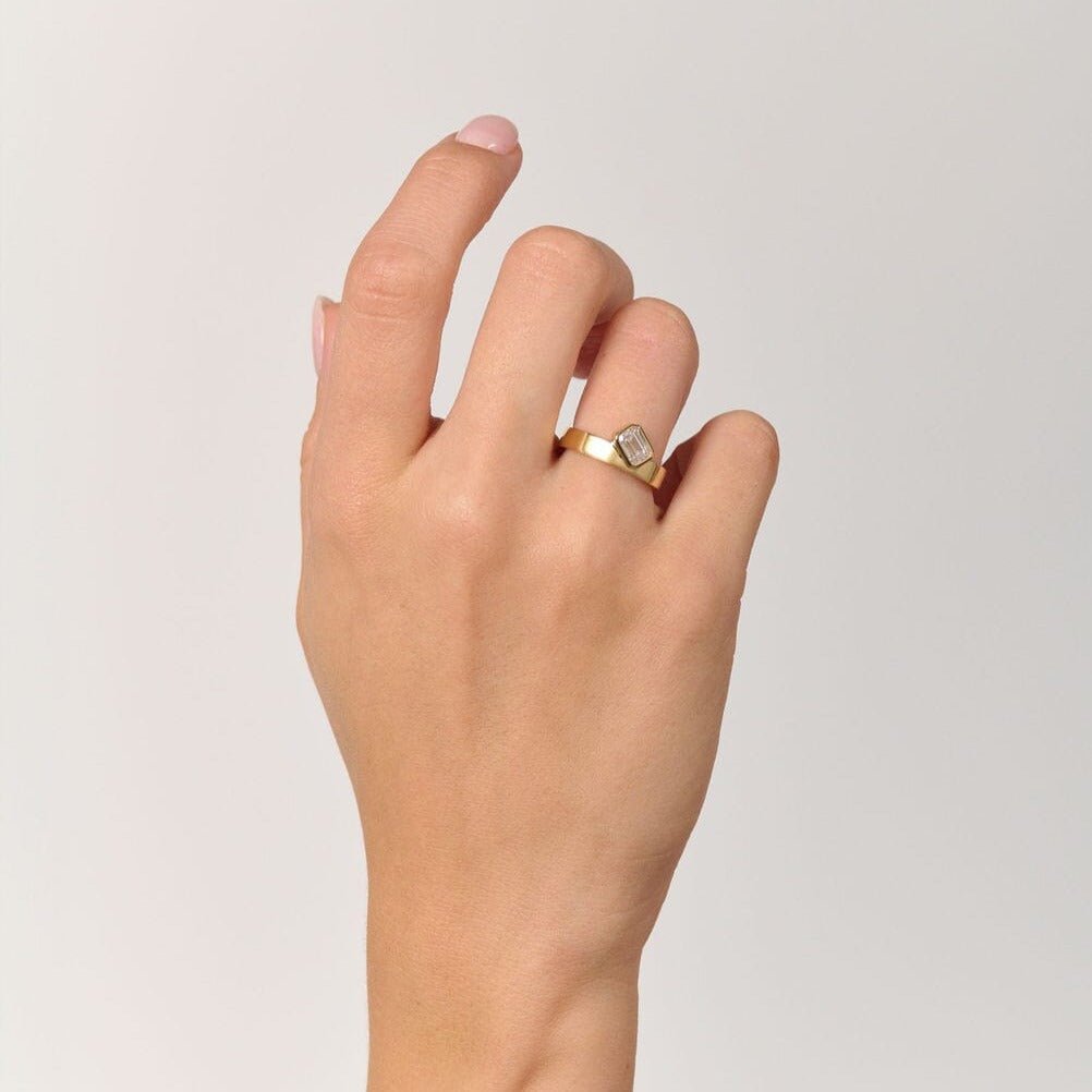 Rings-Part of the Le Courage collection, the Morgan is inspired by the powerful Celtic Goddess of War, Fate and Death who is called on for protection and inspiration. The strong straight windows of the emerald cut stone on the thick gold band pay homage to the courage and strength this mysterious goddess represents.-ELIISE MAAR JEWELLERY