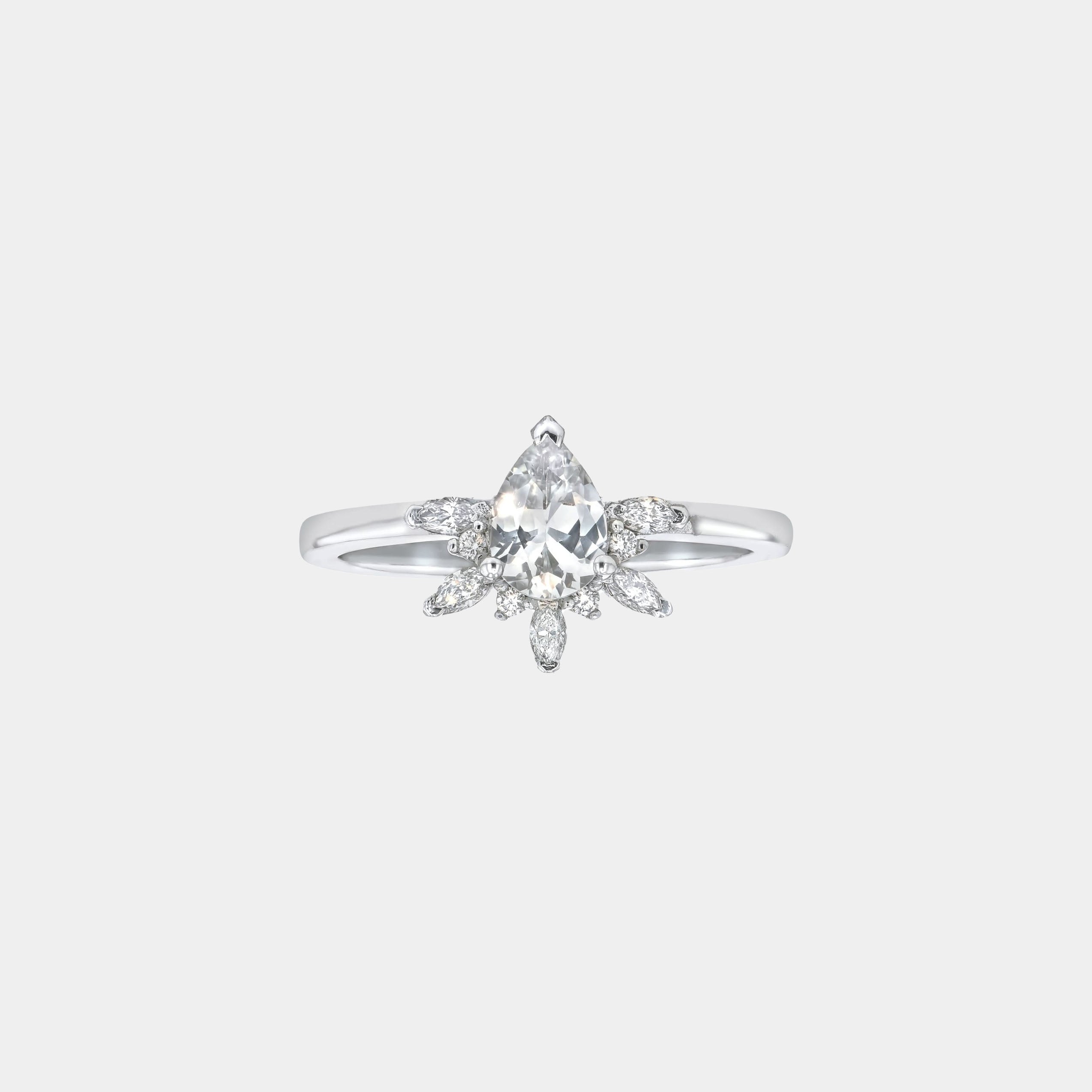 Rings-Feminine, nostalgic nod to the beauty, timelessness and grace of what it means to be woman. Centre stone is a stunning white sapphire completed with a divine diamond halo. Destined to be your forever obsession. Product Details - Features a 0.70ct natural white sapphire- Half halo features marquise and round F/SI1 natural diamonds (approximately 0.20ct)- Shop the Natasha Diamond Crown to complete the set- The ring is 1.85mm wide and 1.6mm thick-ELIISE MAAR JEWELLERY