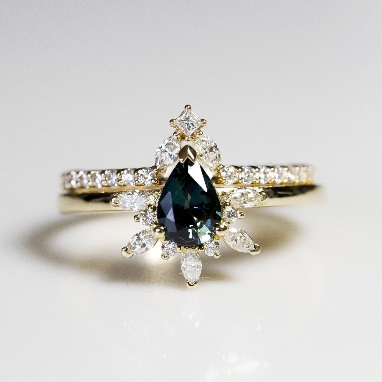 Rings-Feminine, nostalgic nod to the beauty, timelessness and grace of what it means to be woman. Centre stone is a stunning Australian Sapphire completed with a divine diamond halo. Destined to be your forever obsession. Product Details - Features a 0.70ct natural deep blue Australian Sapphire- Half halo features marquise and round F/SI1 natural diamonds (approximately 0.20ct)- Shop the Natasha Diamond Crown to complete the set- The ring is 1.85mm wide and 1.6mm thick-ELIISE MAAR JEWELLERY