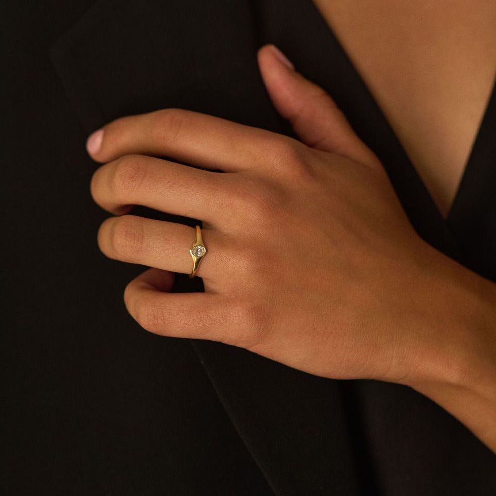 Rings-An exquisitely dainty signet band. Set with an oval diamond, this signet is perfect as a pinky ring or tasteful ring on any finger. Stunning by itself or paired with the Staple Signet Diamond Band for extra elegance. Matching Staple Signet diamond band is available to purchase separately here-ELIISE MAAR JEWELLERY