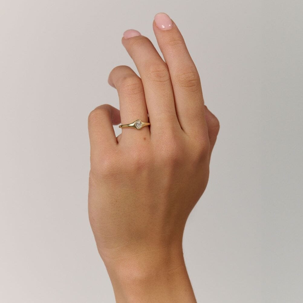 Rings-An exquisitely dainty signet band. Set with an oval diamond, this signet is perfect as a pinky ring or tasteful ring on any finger. Stunning by itself or paired with the Staple Signet Diamond Band for extra elegance. Matching Staple Signet diamond band is available to purchase separately here-ELIISE MAAR JEWELLERY