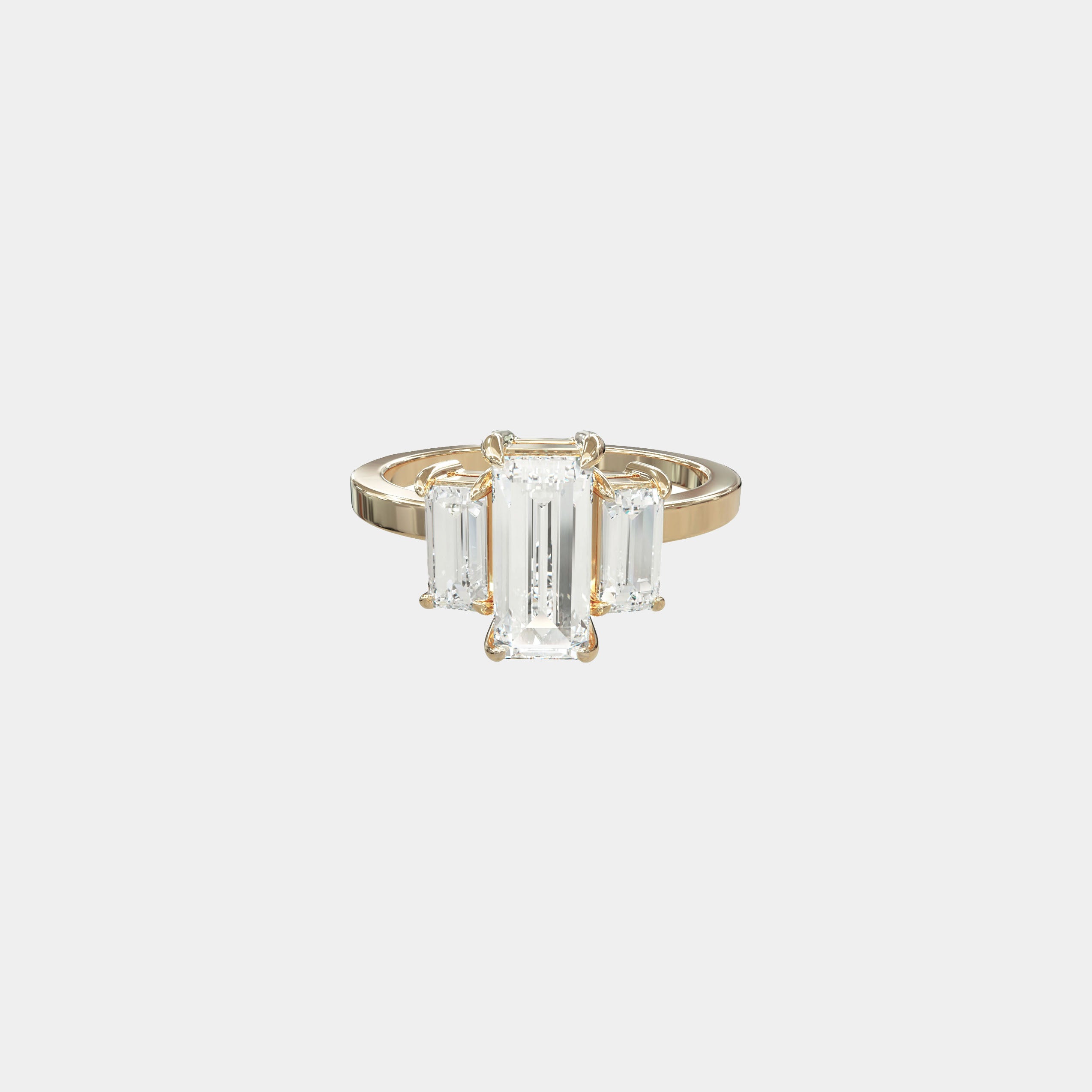 Rings-The Polly Baguette Trilogy is a celebration of clarity, balance, and the unspoken power of presence. At its core, a vertical emerald-cut center stone rises with intention - accompanied by twin baguette-cut sentinels, each aligned in quiet harmony. This triad of precision-cut gems evokes equilibrium and purpose: a sacred geometry of self-alignment, of inner light held steady. The diamonds are set in graceful claws, their sharp symmetry softened by the warmth of a polished finish. Every line, every face