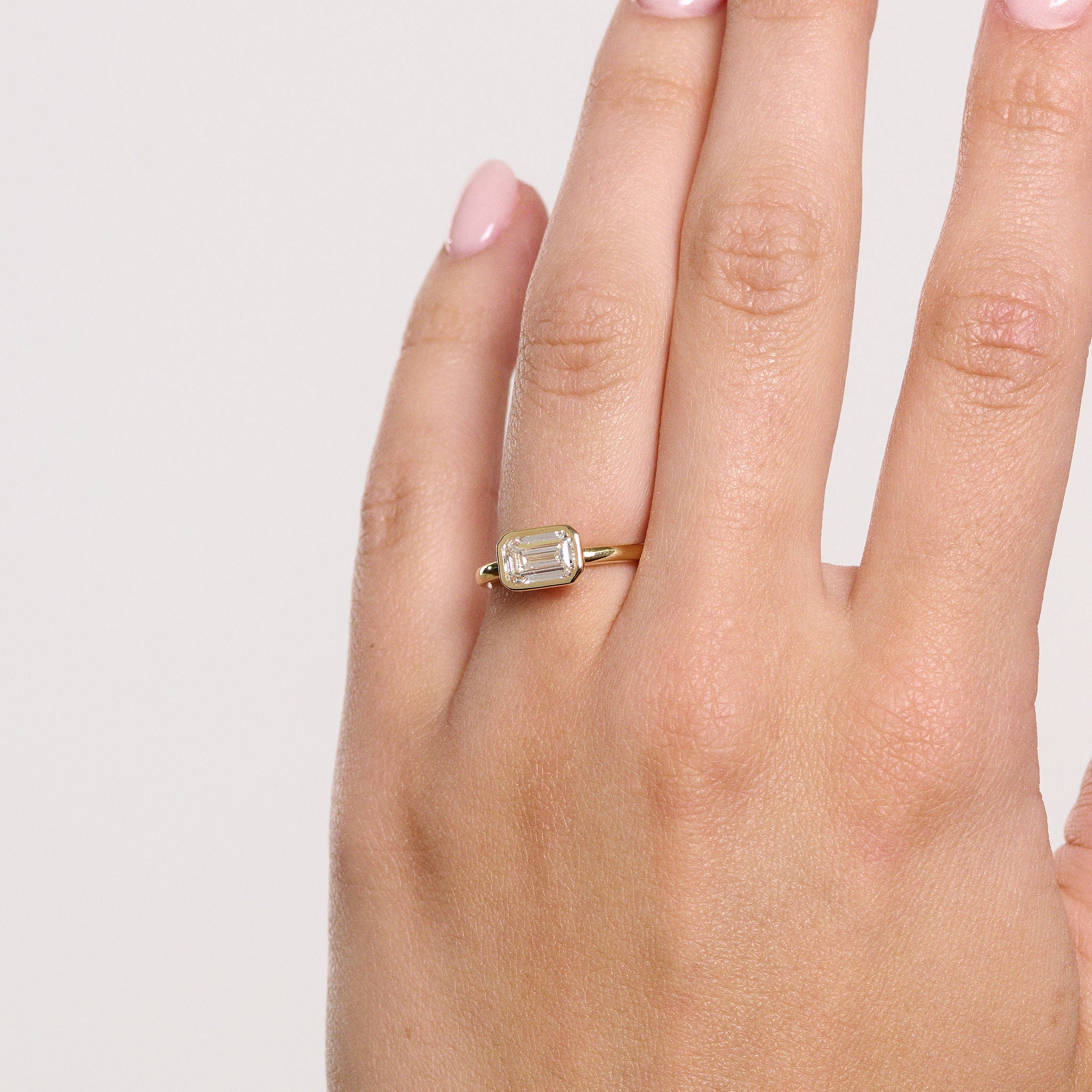 Rings-The Stephanie is truly effortless and timeless. The full bezel setting around the emerald cut diamond makes this ring unique and bold. Fall in love forever with this stunning design.-ELIISE MAAR JEWELLERY