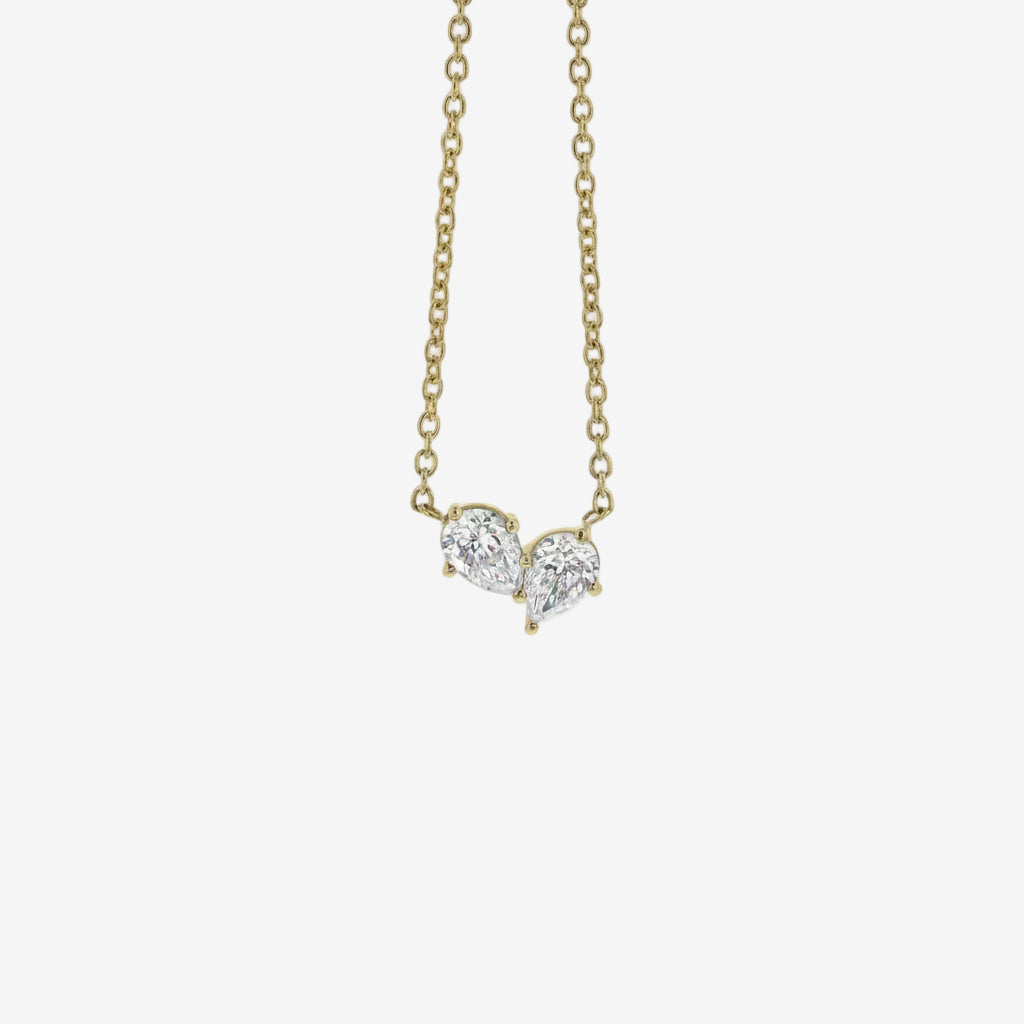 Necklaces-This enchanting heart shaped birthstone necklace looks like a spark of celestial beauty. Two individual, sparkling pear-shaped stones, customizable to each of your beloved's birth months. Luxe Necklace - Features 6x4 Pear Cut Gemstones (total carat weigh 1.00ct) JANUARY Garnet FEBRUARY Amethyst MARCH Aquamarine APRIL Diamond MAY Emerald JUNE Pearl JULY Ruby AUGUST Peridot SEPTEMBER Sapphire OCTOBER Tourmaline NOVEMBER Citrine DECEMBER Blue Topaz Whether worn as a reminder of someone special in you